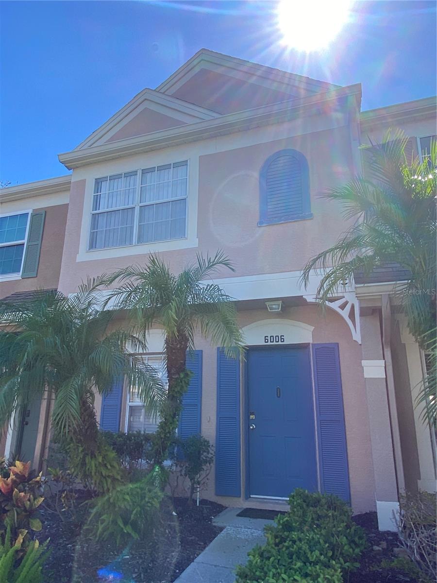 MOVE-IN READY! Discover this 2-bedroom, 2.5-bathroom townhome located in the gated Bayside Key community. This property features an open floor plan with vaulted ceilings and a spacious living and dining area. The kitchen includes stainless steel appliances, a breakfast bar, and a pantry. The first floor also offers a half bathroom and a laundry area. Upstairs, both bedrooms feature private bathrooms, while the primary bedroom includes high ceilings and two closets. Enjoy the screened-in lanai overlooking a landscaped common area and community pond. Bayside Key offers a community swimming pool, tennis courts, and a dog walking area. HOA services include lawn maintenance, water, sewer, trash collection, and exterior building maintenance. Conveniently situated near Tampa International Airport, beaches, shopping centers, restaurants, and major roadways. This townhome offers a great opportunity to enjoy low-maintenance living in a gated community. Schedule your showing today!