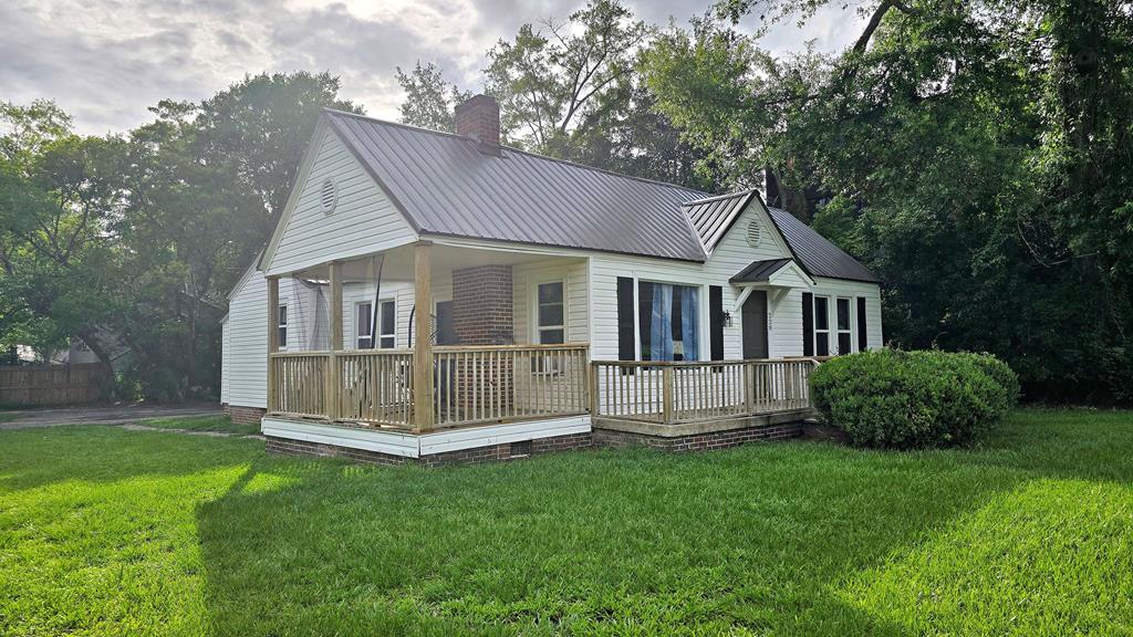 Nestled in the heart of downtown Thomasville (described as "a small town with a big charm" by Southern Living) this rare DG Downtown General zoned property offers exceptional flexibility for residential, commercial or mixed-use opportunities in one of the South's most beloved destinations.  Live here, work here or create an income-producing investment steps from iconic downtown with its historical architecture, boutique shopping and celebrated culinary scene.  Whether you envision a stylish residence, retail concept, office space, boutique lodging or creative live/work environment, the possibilities are extensive.  Property features 1479 square foot home with 0.22 acres fronting Gordon Ave (corner lot) and Neel Pl..  4 br/1 bath offers a lot of space for offices, studio or other commercial uses (per zoning).  Recent improvements include new metal roof and updated flooring.  Ample parking.  Property is currently OCCUPIED with "month-to-month" residential lease.  DG zoning permits an exhaustive list of possible uses (subject to city planning and permitting) such as personal care homes, condominiums, multi-family residential use as well as home occupations, schools, private clubs, photography and dance studios.  Retail, specialty and clothing shops, drug stores and flower shops, professional offices, beauty salons, banks, service shops, food stores and community gardens or general office.  Hotels and restaurants, too.  RARE OPPORTUNITY.  PLEASE NOTE - adjacent property at 208 Neel Pl. (zoned DG) is also listed (same owner).  Tenant occupied.  Both properties offered individually or could be purchased together (if still available) and would front three streets. Check other listing.