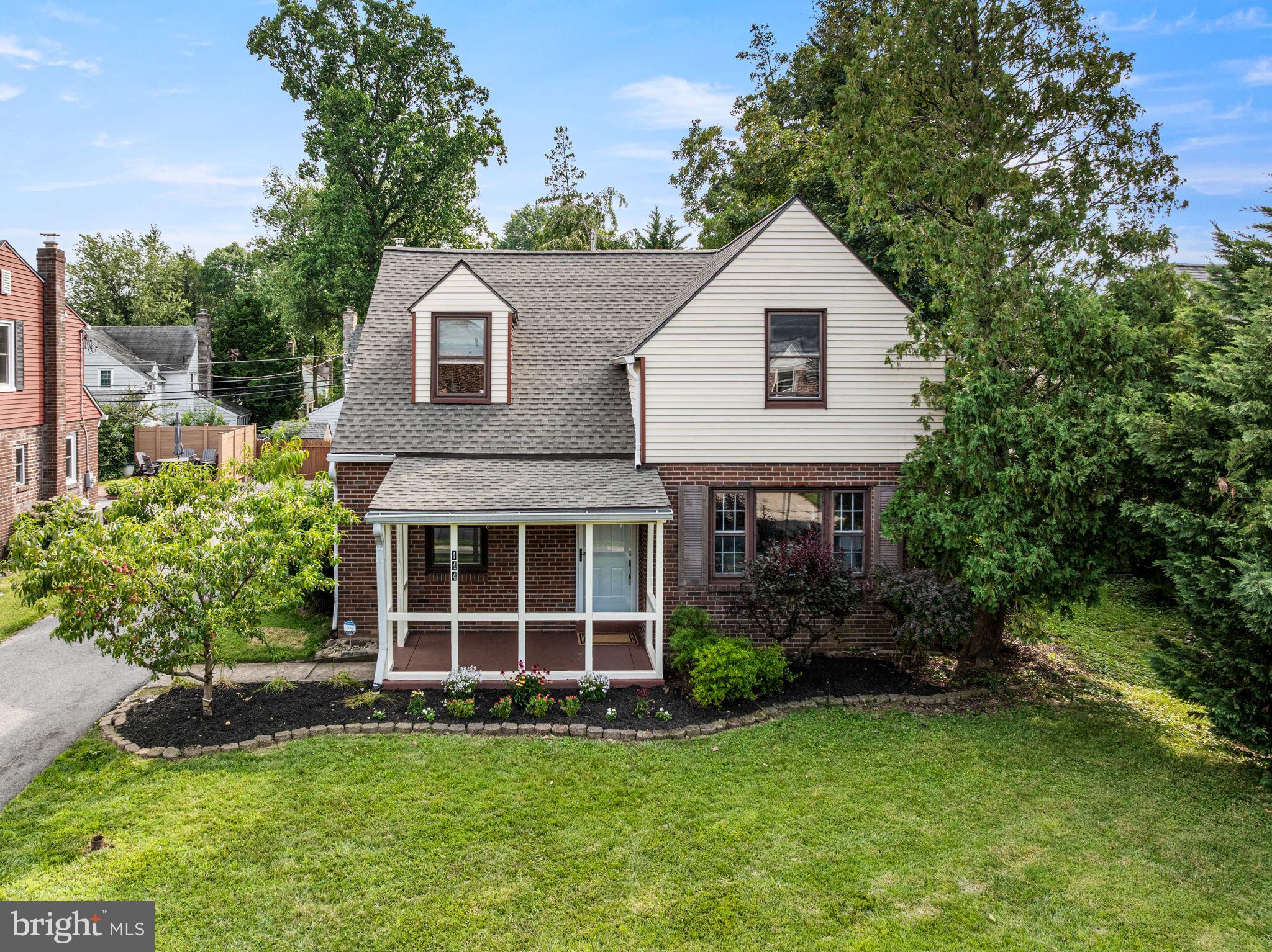 Welcome home! This move-in ready, classic brick Colonial is in the sought-after neighborhood of Penn Wynne. This 3-bedroom, 2-full bath home offers traditional charm combined with modern updates. An easy walk to the Penn Wynne library, top-tier Lower Merion schools, shops, parks, and transportation links for a stress-free commute into Center City. Before you even step through the front door, you’re greeted by a covered front porch - it’s the ultimate spot to enjoy your morning coffee. As you step into the Foyer of this center hall Colonial, you’ll find the staircase to the second floor and a circular flow featuring hardwood floors, a neutral color palette, baseboard molding, and abundant natural light. The spacious Living Room features a picture window with views of the front yard and elegant archways. This space flows seamlessly into the Dining Room which has a ceiling fan, recessed lighting, double window, and is ideal for hosting gatherings with family and friends. The heart of the home is the stunning 2020 Kitchen renovation. By opening the space to the Dining Room, the owners created a chef’s dream featuring quartz countertops, recessed lighting, and a breakfast bar. The stylish tiled backsplash, abundant modern cabinetry, soft-close drawers, ceiling fan light and ceramic tiled floors add a contemporary look. The convection oven, induction cooktop, built-in microwave, and ample counter space make meal prep a breeze. A convenient back door leads to the attached one car garage, driveway, and backyard. Enjoy the private backyard – perfect spot for a swing set, firepit, or hosting a summer BBQ plus enjoy a bonus vegetable garden on the side yard and a peach tree in the front yard. The main level also includes a renovated full bath with subway tile in the shower and half walls with modern vanity. A versatile Family Room/Home Office features a glass French door, ceiling fan light, chair rail, coat closet, and sliding barn door that connects back to the foyer. The finished basement has recessed lighting and is a flexible space perfect for exercise, playtime, or movie night with an unfinished area for laundry, utilities, and storage. Upstairs, hardwood floors and baseboard molding continue into hall and all three bedrooms. The primary bedroom features three closets, a sitting area, and ceiling fan light. A second bedroom features shutter style wainscoting accent, a ceiling fan light, and a window bench. The third bedroom with ceiling fan light and a beautifully renovated hall bathroom with a tiled shower-tub combination and ceramic tiled floor plus hall storage closet complete the second floor. Recent upgrades including New Roof (July 2026), New Front and Back Doors with satin nickel door handle sets and Screen Doors (July 2026), Freshly painted front porch (July 2026), Newer hot water heater (2022), seal coated driveway (2023), upgraded 200-amp electric (2020), New Front Porch Light (July 2026), and New Garage Door Opener (2026). This home offers an unbeatable Main Line location in the award winning Lower Merion School District where a new cafe, bookstore, and ice cream shop are all steps away. Don’t miss the opportunity to make this home yours!