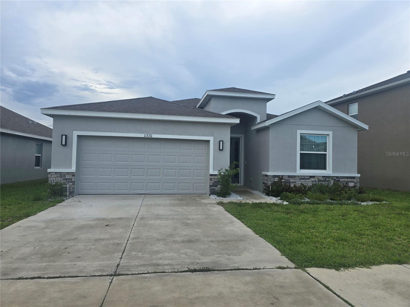 Located in the beautiful Waterford community, this nearly new 4-bedroom, 2.5 bath home built by D.R. Horton offer 2,057 square feet of modern living space and was completed in 2023. Lightly lived in and exceptionally maintained, this smart home features quartz countertops,stainless steel appliances, an open-concept layout, and stylish finishes throughout.This spacious kitchen includes a large center island with seating and flows seamlessly into the dining and living areas, creating an ideal space for entertaining and everyday living. The private primary suite features an ensuite bath with dual vanities, garden tub, walk-in shower, private water closet, and oversized walk-in closet. Built with block construction and stucco exterior, the home also includes in wall pest control protections for added convenience.Step outside to the covered rear patio, perfect for morning coffee or relaxing evenings and there are no backyard neighbors. For additional privacy fences are allowed. A  2-car garage  provides ample parking and storage space. With limited 4 bedroom homes available in the community, this property stands out as an exceptional opportunity in the Waterford's original phase.Leasing is permitted, making this property attractive for both homeowners and investors  alike. Schedule your showing today and experience the lifestyle Waterford has to offer.