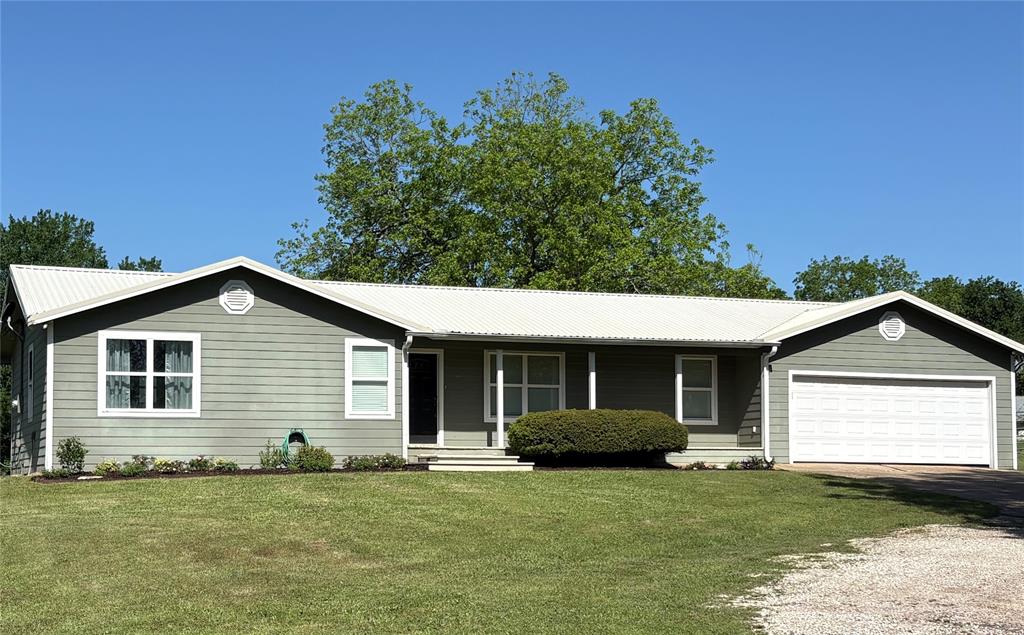 Here is your country farm house home on nearly 4 acres and only minutes from town. Located in the family first community of Reilly Springs with recent modern updates that make it move in ready! The wide circle drive around the huge shade trees makes parking a breeze. The family area features wood flooring, crown molding, custom trim, built in bookcase and a gas log fireplace. The kitchen is thoughtfully laid out with granite countertops, custom backsplash, stainless steel appliances, custom cabinets, pantry and tankless water heater. The private master has a 2nd gas log fireplace, crown molding, ceiling fan, a large walk-in closet and large bath with jacuzzi tub. The large covered back porch provides a private place to relax and look over the back of the property down the hill to the creek or a great area for entertaining guest. The small creek meanders through the property with a bridge to access the southern side of property.  The trees along the creek and the tree lined boundaries create a natural privacy barrier. There is plenty of room to add a large shop or second residence (tiny home) if desired with road frontage on 2 county maintained roads. The large amount of road frontage creates many opportunities.  Located in SSISD and with enough room for a few horses, calves, chickens, etc. and still have room for a large garden spot in the fertile sandy soil. This property has a private water well and located on great aquifer for great fresh water. The metal roof and cement plank siding allow for low maintenance ownership. READY TO MOVE IN and NO KNOWN RESTRICTIONS Located only 10 minutes from Sulphur Springs and only a few miles from Lake Fork to allow for some great East Texas living.