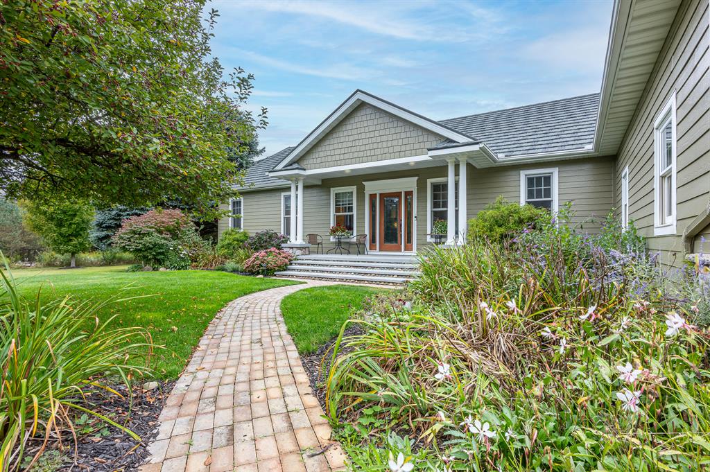 Experience timeless craftsmanship and country beauty with this stunning Amish-built walkout ranch home, perfectly set on nearly 50 acres of serene land. From the moment you step inside, you'll be captivated by the warm character of natural wood and beautiful hardwood floors that flow throughout the home.The open design invites you to enjoy breathtaking views from every angle, with a spacious deck complete with an awning--ideal for relaxing evenings overlooking your amazing flower gardens, a peaceful creek, and a private pond.Outdoors, this property is a true homesteader's dream. A large pole barn and shop building provide endless opportunities for hobbies, storage, or business use. Whether you're drawn to gardening, farming, or simply enjoying wide-open spaces, this property offers it all.Are you a hunter?  Love wildlife?  Outdoor enthusiast will love the rustic charm with modern comfort in a private, picturesque setting that this amazing property offers