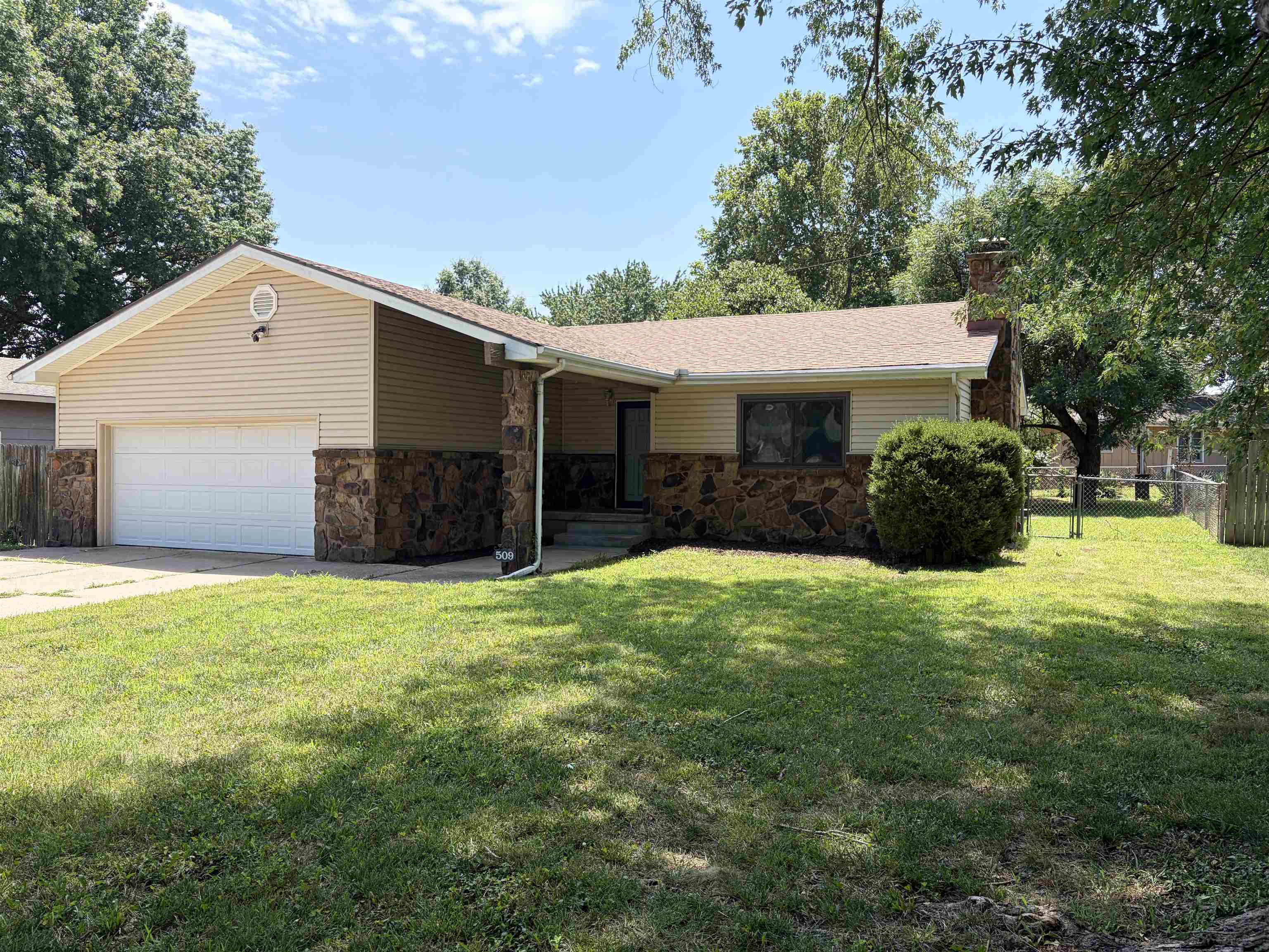 Move right into this beautifully updated ranch home offering plenty of room both inside and out. Situated on a spacious lot, the property features low-maintenance vinyl siding, a fully fenced backyard, and a gorgeous wood deck that’s perfect for relaxing or entertaining. The welcoming living room showcases rich hardwood floors and a cozy wood-burning fireplace. The kitchen is designed with functionality in mind, featuring solid surface countertops, generous cabinet space, and an adjoining dining area. The main floor includes three comfortable bedrooms with brand-new carpet and 2 updated full bathrooms. The master ensuite features three closets and a bathtub/shower combination. The finished basement expands the living space with a large family room, a fourth bedroom complete with a newly installed egress window. Recent improvements throughout the home include fresh paint, modern lighting, updated knockdown texture, and refreshed bedrooms and bathrooms. Renewal by Andersen replacement windows provide added energy efficiency and a polished finish to this move-in-ready home.