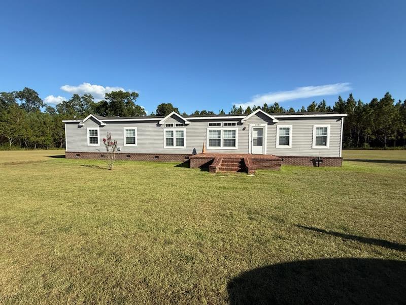 Looking for privacy with a view? This 4BR/2BA home on 2?3 acres along Ozell Rd. is waiting for you! ? With a little love and fresh paint, it can truly shine.