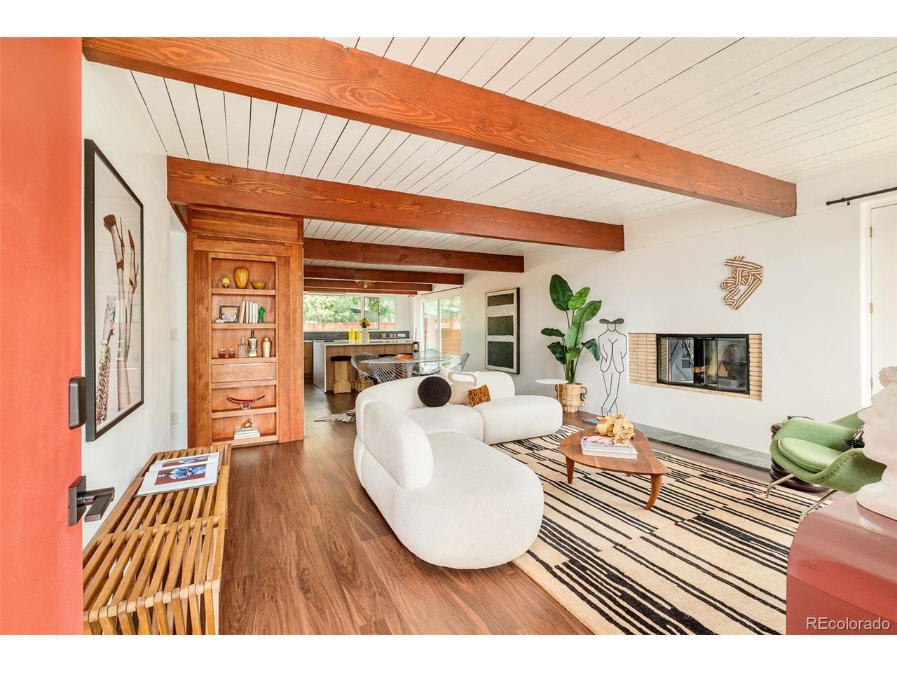 Motivated Sellers * Seeking offers! | This beautiful mid century modern home, part of the historic Arapahoe Acres community, sits on the cusp of some of Denver-metro's finest neighborhood sweet spots such as Cherry Hills, Cherry Hills Country Club, Denver's high line canal, Platt Park, and has convenient access to top schools, some of Denver's finest restaurants, and hospitals. 1401 E Dartmouth Avenue, designed by Edward Hawkins and Eugene Sternberg, has been undeniably elevated through recent renovations while sustaining it's distinctive original features giving it both charm and authority; This south-facing Arapahoe Acres home, like most classic mid-century modern homes, is positioned towards an open-facing back/private-side of the home, bringing attention to the open kitchen, large yard and outdoor dining space, all while featuring a special and unique kind of privacy only a mid-mod home can offer and especially so as part of this neighborhood enclave in the greater Denver-metro area. The home has two bedrooms and one fully renovated full-bathroom, a new kitchen with a large island and tastefully hidden storage spaces, cabinetry that blends it's elevated displays with purposeful storage and utility. (See the laundry-chute and secret-door to it's built-in laundry and tankless-water heater access.) The new appliances and original built-in wood-burning fireplace positioned as the focal point in the primary living space allow for a sense of balance (in style, vintage, and lighting) which exists throughout the home. The home has a unique amount of privacy complimented by incredible natural light, enhanced by large windows across the backside of the home, thoughtfully directing light throughout the home accented by large wooden beams (featured across the ceilings throughout the entire home.)Additionally, the property features an attached single-car garage, a private gated-backyard, and well-maintained fences to keep kids, pets, and lawn games safe.