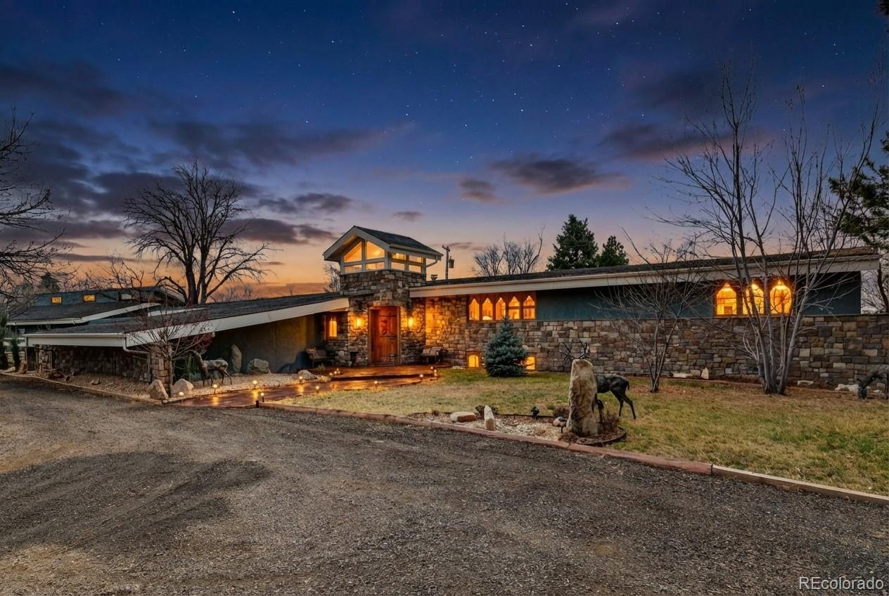 A Mid-Century Masterpiece of Luxury and VersatilityExperience the pinnacle of sophisticated living in this breathtaking mid-century estate. From the moment you pass through the private gated entrance, you are welcomed by architectural brilliance and high-end finishes that define modern luxury.Exquisite Interior DesignThe grand foyer makes a powerful first impression with its custom cherry rosewood front door, showcasing handmade floors with custom inlays and exquisite accents. The main level flows seamlessly, anchored by a gourmet kitchen that belongs on the cover of a magazine. Designed for the ultimate host, it features abundant storage and a massive mobile island that glides effortlessly to create the perfect entertaining layout.Unparalleled Primary RetreatThe primary suite is a magnificent two-story sanctuary. This true retreat features:Dual Bathrooms: A lavish 5-piece bath plus an additional 3/4 bath.Luxury Convenience: A boutique-style walk-in closet with its own dedicated laundry.Outdoor Serenity: A private deck overlooking a tranquil koi pond and a spectacular 40ft+ waterfall.The upper level includes a second en-suite bedroom, while the lower level offers two additional oversized bedrooms and a full bath, providing ample space for family or guests.Entertainment and UtilityRelax in the expansive media room or utilize the large laundry/mudroom conveniently located off the great room.An Enthusiast’s Dream GarageFor those with a collection, the property boasts a 2,500 sq. ft. attached garage with soaring ceilings—perfect for a Class A motorhome, a professional workshop, or a multi-car gallery. Daily convenience is handled by a large attached carport with direct kitchen access. With additional parking for boats and RVs throughout the grounds, there is truly room for everything.