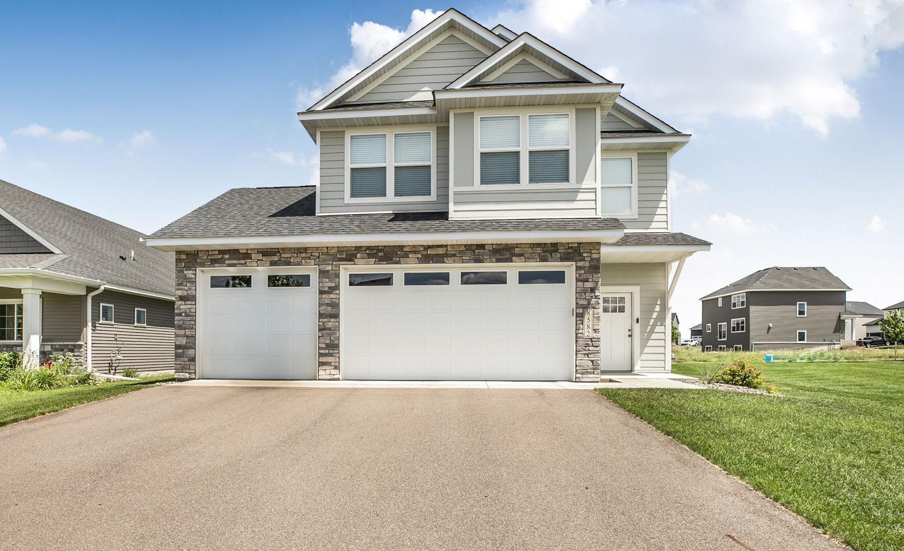 Why wait to build when you can move right into this like-new 4-bedroom, 3-bath two-story home! Meticulously maintained, this home offers modern finishes and functional living spaces throughout. The upper level features four spacious bedrooms (that includes a private primary suite with a walk-in closet and ¾ bath), a versatile loft/flex, full bath and laundry. On the main level, you'll find an inviting open-concept floor plan with 9-foot ceilings, 1/2 bath, and a cozy electric fireplace in the living room. The main floor kitchen is beautifully appointed with soft-close cabinetry, granite countertops, stainless steel appliances, luxury vinyl plank flooring, and a large walk-in pantry. The adjoining dining area provides an ideal space for everyday meals and entertaining. Step outside to enjoy the stamped concrete patio and underground sprinkler system, making outdoor living and lawn maintenance a breeze. Large 24x30 finished  garage. Conveniently located near schools, shopping, and parks, with quick access to I-94 just five minutes away, this home offers an easy commute while keeping you close to everything you need. This is the perfect opportunity to enjoy the benefits of new construction without the wait!