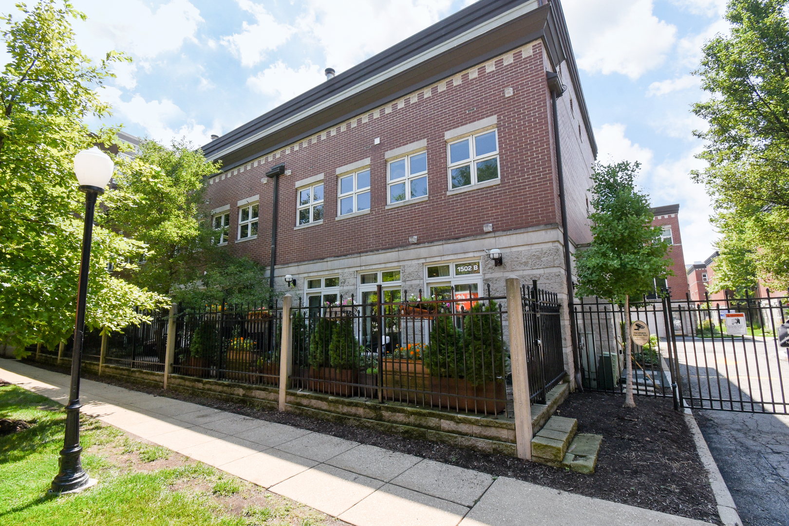 Welcome to your move-in ready oasis in one of the South Loop's most coveted gated townhome communities! Be the envy of your neighbors living in this quiet, private courtyard-facing, two-story townhome with a massive end-unit patio. Phenomenal floor plan includes an open-concept living room with a custom wood-burning fireplace, updated kitchen with newer stainless appliances, custom island, and quartz counters. Rare layout with a powder room on the main level. Kitchen and living areas are flooded with natural light and lead to the patio with custom-designed pavers, rustic planters with arborvitae, and a hydrangea tree for privacy. This home has been substantially updated during the current owner's tenure, with all major mechanicals and appliances modernized. Spacious bedrooms on the 2nd level, both with updated en suite bathrooms. Newer in-unit laundry conveniently located on the 2nd level as well. Private 1-car garage + 1 exterior pad space included for a 2nd vehicle. High ceilings in the garage offer additional storage space. Steps to the Lake, Soldier Field, Museum Campus, three nearby parks, and Fred Anderson Dog Park. Easy access to LSD, 90/94, and red/orange/green EL lines. South Loop Elementary. Extremely pet- and kid-friendly, with 2 dog parks and a children's park just minutes away. Over $800,000 in reserves with recent community modernization projects completed. No upcoming specials, no rental restrictions. Seller needs occupancy through October 31.