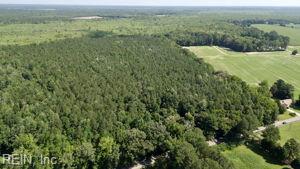 Embrace an extraordinary opportunity to own this stunning country property, just minutes from the VA Beach Municipal Center and the Chesapeake Expressway. Spanning nearly 44 acres, this expansive, mostly wooded estate features hardwoods and towering mature pines, making it a nature lover's dream.
This highly sought-after tract is more than just land; it's a prime hunting zone teeming with deer and turkey, offering endless outdoor adventures right at your doorstep. With AG1 zoning and the potential for at least one homesite, your vision can come to life here. Whether it’s building your dream home, constructing barns, or outbuildings (subject to City of VA Beach approvals), the possibilities are endless.
Imagine creating your ideal retreat with trails for equestrian pursuits, ATV riding, or simply basking in the serene landscape. This property is a canvas for your lifestyle dreams—where outdoor recreation meets tranquil living.
Don’t miss out on this rare gem. Call today!