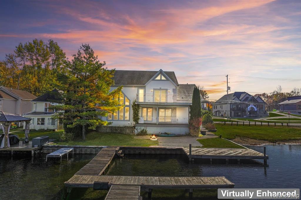 Lakefront living at it's finest! Welcome home to this beautiful modern home on Lake Fenton! With 4 bedrooms, 3 baths, and a wide open floor plan, this is the perfect place to relax by the lake. High ceilings, tons of natural light, and roomy spaces make this home feel airy and bright. Up to date kitchen with plenty of storage and counter space, spacious bedrooms, and big closets complete the home. Enjoy everything that Lake Fenton has to offer! Schedule your showing today!