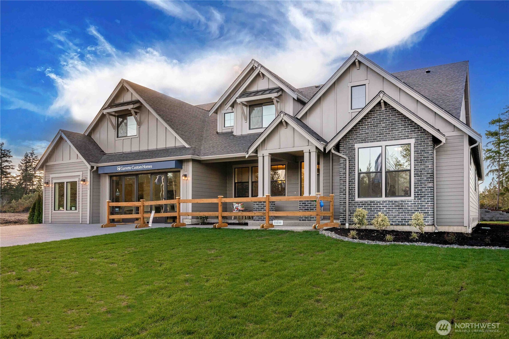 HOME TO BE BUILT — The SHASTA XXL home at The Reserve at Washington National, built by the 2025 Seattle Times Builder of the Year, GARRETTE HOMES. Buyer to select structural options and design options at our design studio. This plan offers true main-level living with a Primary Suite on the main featuring a luxurious 5-piece bath, plus an attached fully independent multi-gen suite with its own entrance, patio, laundry, and garage. The main home includes 12' ceilings in the great room, a covered outdoor patio, den, and formal dining with a butler’s pantry. Situated on 1.15 acres in a premier golf course community. Photos are representative only.