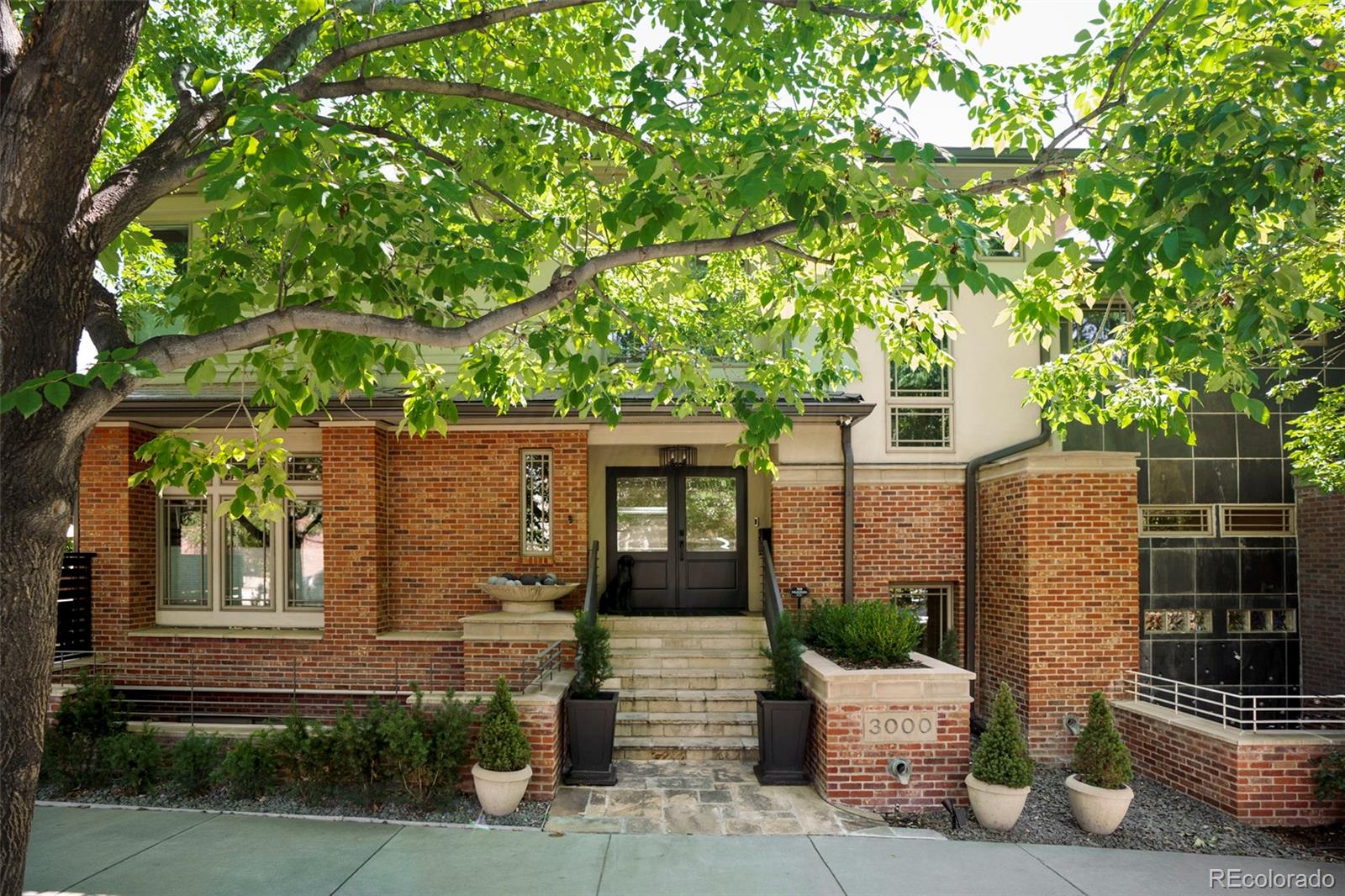 Welcome to this fully updated architectural gem, an exceptional townhome ideally situated in the heart of Cherry Creek North. What sets this residence apart is the sense of privacy it offers. Designed with the feel of a single-family home, it shares a minimal connection with its neighbor while the private entrance is positioned on a separate street. In 2024, significant upgrades include Guest Bathroom Upstairs and Lower Level Bathroom, Boiler/Hot Water System & Interior/Driveway Radiant Heat Controls, Air Conditioning System, Front Door, Roof and Gutters, Exterior Patio Gate and Fencing, Basement Tile and Carpet, Window Treatments, Landscaping Improvements and Epoxy Garage Flooring. Notable renovations from 2022 include Kitchen Remodel with Wolf and Sub-Zero appliances and an oversized island with honed Quartzite stone, Accordion Doors off of Kitchen to the deck, Primary Bath and Bedroom Remodel, Powder Room Remodel, Main Level Tile and Light Fixtures. The main level offers a beautifully updated kitchen, a versatile dining room or private office and an inviting living room with cozy 3-sided gas fireplace, deck and courtyard. Upstairs the primary suite features an updated five-piece en-suite bath, custom built-in closet and convenient laundry area. The second upper level bedroom includes updated en-suite bath. The lower level features a spacious gathering area and an additional non-conforming bedroom that offers flexibility as a home office, gym or private guest space. The courtyard and deck are added luxuries with space to entertain or enjoy your morning coffee. Elevated by an oversized heated two-car garage and rare heated driveway, distinctive architectural character, beautifully considered design and coveted Cherry Creek North setting. This residence offers an extraordinary blend of privacy, sophistication and convenience. Welcome home.