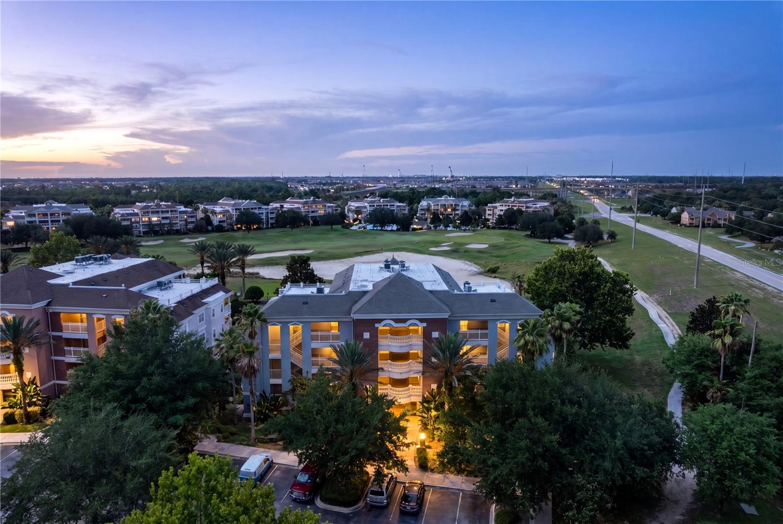 REUNION RESORT MEMBERSHIP INCLUDED AND ALREADY PAID — allowing the next owner immediate access to Reunion's world-class amenities without the substantial initiation expense.Whether you're searching for a luxury vacation retreat, seasonal residence, or income-producing investment, this beautifully maintained and FULLY FURNISHED 3-bedroom, 3-bath END UNIT villa offers the perfect blend of comfort, privacy, and convenience. Filled with natural light and featuring newly installed modern flooring throughout, the residence showcases a spacious open-concept design, tasteful furnishings, and true turnkey ownership.One of the standout features is the expansive private storage room located directly outside the front door—providing ample space for owner belongings, golf clubs, luggage, holiday décor, and personal items rarely found in comparable resort properties.Step onto the oversized covered balcony and enjoy peaceful golf course views, spectacular Florida sunsets, and the added privacy that makes Sunset View one of Reunion Resort's most desirable villa communities. Currently participating in Reunion Resort's rental management program, this property offers owners the flexibility to enjoy the home personally while generating income when not in residence.Located just moments from the community pool and waterslide, owners and guests enjoy access to three signature golf courses, multiple resort pools, a water park, lazy river, dining venues, tennis, pickleball, playgrounds, shuttle service, and more—all just minutes from Walt Disney World and Central Florida's premier attractions.Clean, updated, fully furnished, membership included, and rental-ready—this is resort living made easy, so call us today to schedule your own private showing!