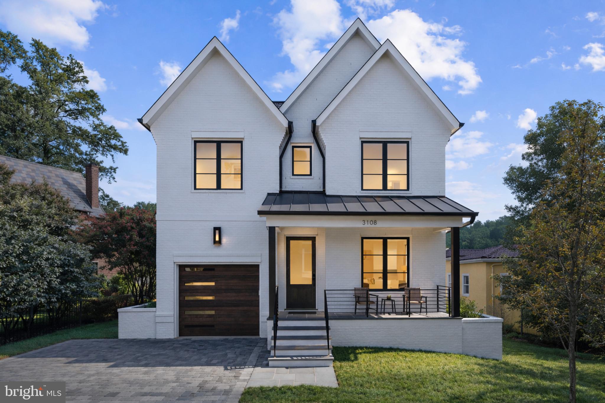 A rare new construction offering in Lyon Village, 3108 Key Boulevard presents a well executed residence on one of the neighborhood’s most desirable tree lined streets.Set on a level, evenly shaped lot in the heart of Lyon Village, the home offers approximately 6,010 square feet across four finished levels, combining scale, privacy, and exceptional walkability to parks, Metro, schools, trails, and neighborhood dining.The main level is centered around a well executed kitchen and living space designed for both everyday use and entertaining. The kitchen features custom inset cabinetry, a 48” Wolf range, Sub Zero refrigeration, Cove dishwasher, and an oversized island that serves as a natural gathering point. The adjacent family room opens to a screened porch with fireplace and connects seamlessly to the rear patio and yard.The primary suite includes a sitting area, dual walk in closets, and a marble bath with glass shower, along with private views that are uncommon within Lyon Village. Secondary bedrooms are all en suite. The third level loft offers flexible living space with an additional bath and covered porch.The lower level includes a recreation room with wet bar, fitness space, and a guest or au pair suite with walk up access.Additional features include Marvin windows, spray foam insulation with Rockwool sound separation, 10 foot ceilings on the main level, elevator ready construction for future flexibility, an attached garage, and an oversized paver driveway.Built by Rock Spring Homes, a local boutique builder whose principals have lived in Arlington for over 40 years and bring more than 30 years of building experience, with over 100 new homes completed, the residence reflects a consistent focus on quality, proportion, and long term livability.