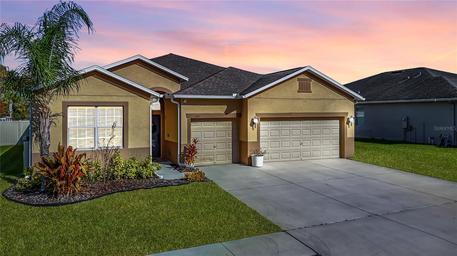 LIVE THE LIFESTYLE you’ve been searching for in this thoughtfully designed 4bed, 3bath, 3-car garage home in Lakeside Hudson, where an open, sunlit layout creates an easy, elevated rhythm to everyday living! At the heart of the home, the kitchen truly stands out - beautifully finished with granite surfaces, an oversized island, and a breakfast bar that naturally draws everyone in, making it just as perfect for weekday meals as it is for hosting. The kitchen also has a new refrigerator and dishwasher! The primary suite offers its own sense of escape with a relaxing garden tub, separate walk-in shower, and dual granite vanities that bring a touch of spa-like comfort to your daily routine. Outside, the experience continues with a PRIVATE SCREENED-IN POOL with brand new pool pump, featuring a wide sun shelf, refined tile accents, and a generous covered lanai overlooking the fully fenced backyard, an inviting setting for quiet mornings, open-air dining in the sunken outdoor kitchen with gas-grill, or evening unwinding. Ceramic tile flooring in the main living areas and soft carpeting in the bedrooms pair style with comfort throughout. Other new appliances include a dryer and water softener. As a resident of Lakeside, you’ll enjoy a host of resort-inspired amenities including a sparkling community pool, tennis and basketball courts, a playground, and a clubhouse designed for gathering and connection. If you’re looking for a home that elevates everyday living, this one is ready to experience. Schedule a private showing today! *** Age of Roof - 2017, Age of A/C - 2017, Age of Water Heater - 2017.