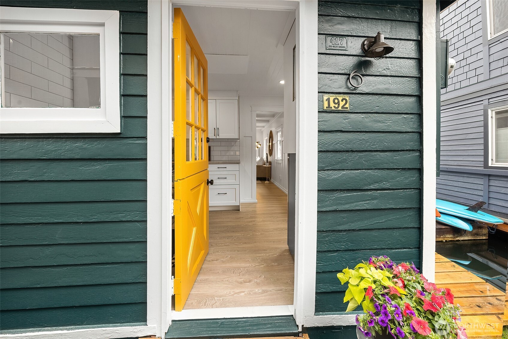 Embrace waterfront living in the heart of the city! Located in the DOX Coop in Eastlake, this charming floating home is one of 32 in this vibrant and unique neighborhood. Thoughtfully renovated in 2025 it seamlessly blends classic character and modern comfort. Enjoy a spacious layout filled with natural light. The home boasts two bedrooms, newly refreshed bathroom and fully renovated kitchen ready for entertaining. The bright and open living room provides ample space for dining as well. Walk out onto the wrap around deck and enjoy an evening lounging off the back covered porch. Come experience this piece of Seattle history, your new waterfront lifestyle awaits!  Approved architectural plans for a new houseboat build available upon request.