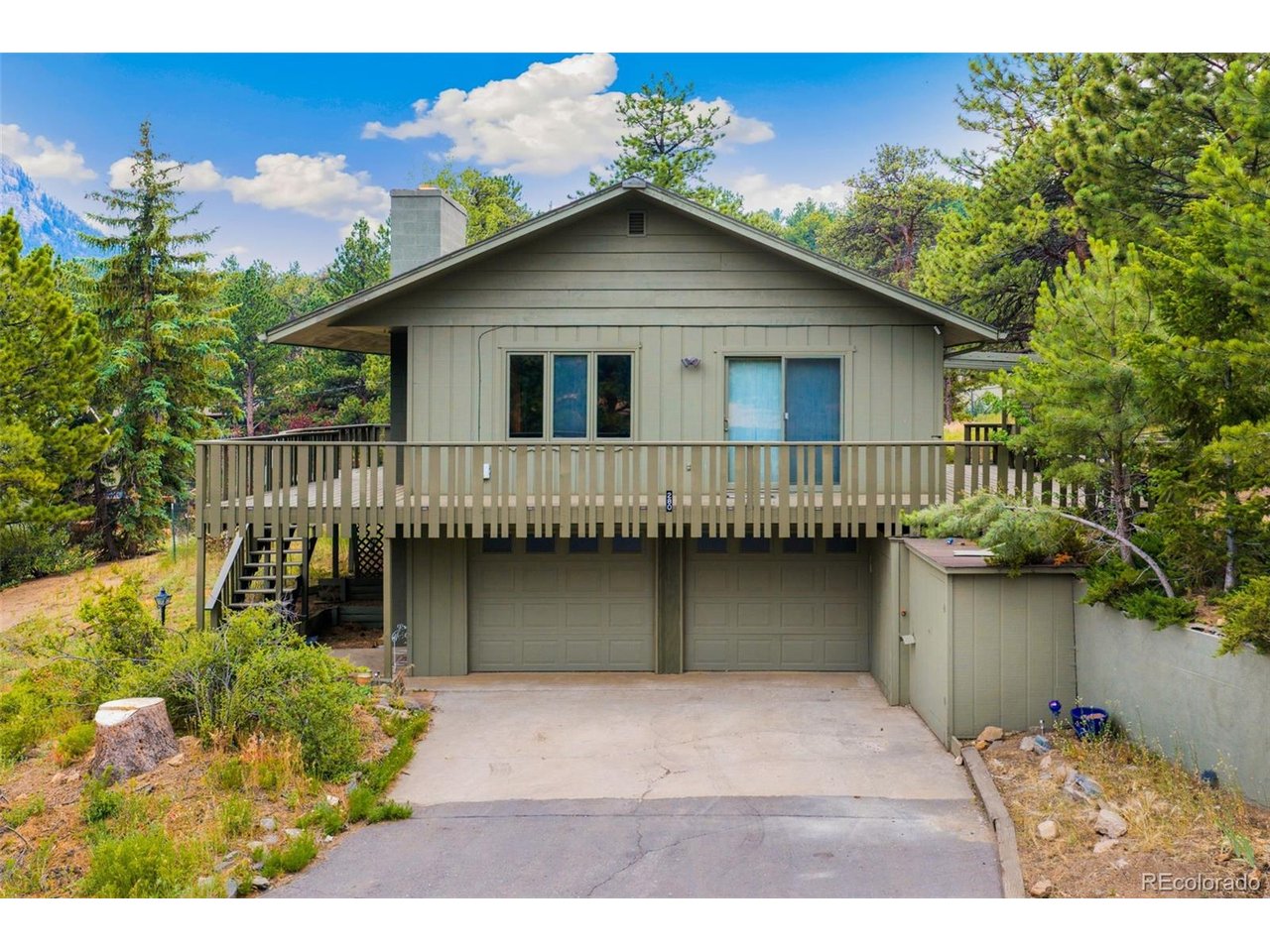 MAJOR PRICE IMPROVEMENT-NOW OFFERED AT $745,000! Welcome to mountain living in beautiful Estes Park. Situated on a peaceful 0.43-acre lot, this 3-bedroom, 2-bath home offers 1,836 finished square feet with comfortable living areas on both the main and lower levels. Skylights bring natural light into the main living area, while the spacious kitchen features granite countertops and ample workspace. In addition to the new carpet, the seller will have the interior freshly painted. Additional highlights include a freshly painted wraparound deck, an attached 2-car garage, an extra-wide driveway and no HOA. Enjoy a peaceful Colorado mountain setting with convenient access to downtown Estes Park, Rocky Mountain National Park, hiking, fishing, shopping and dining. Schedule your private showing today!