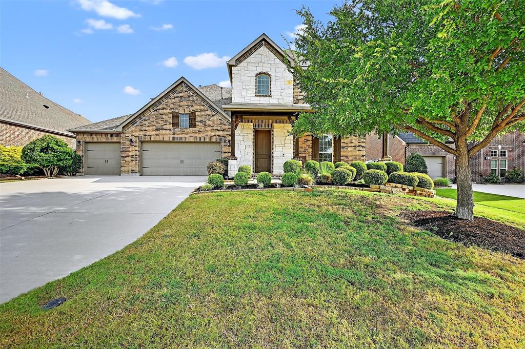 Welcome to 908 Rock Falls Dr, a stunning 4-bedroom, 3.5-bathroom home with over 3,600 square feet of thoughtfully designed living space, located in the highly sought-after masterplanned community of Trinity Falls in McKinney, TX. From the moment you step through the front door, you’ll be greeted by warm wood floors, soaring ceilings, and an inviting home office just off the entryway. The heart of the home is the open-concept kitchen and living area, where you'll find vaulted ceilings with exposed wood beams, a cozy gas fireplace framed by floor-to-ceiling stone, and large windows that flood the space with natural light. The kitchen is a chef’s dream, featuring a massive granite island, rich cabinetry, a gas cooktop, and double ovens—perfect for entertaining or day-to-day living. The oversized primary suite is tucked away on the main floor for added privacy and features a luxurious en suite bath with dual vanities, a garden tub, separate shower, and an expansive walk-in closet with custom built-ins. Upstairs, a spacious second living area provides extra room to relax or play, along with three generously sized bedrooms and a large attic room that is framed out and ideal for additional storage or future finish-out. Step outside and enjoy the show-stopping backyard, complete with a covered patio, an extended pergola-covered entertaining area, a tranquil waterfall, a built-in firepit with surrounding seating, and still plenty of grassy yard for play, pets, or gardening. Living in Trinity Falls means access to incredible amenities—walking trails, community pools and splash pads, a fitness center, playgrounds, dog park, lakes, and a calendar full of community events—all just minutes from historic downtown McKinney and major commuting routes. This home truly has it all—space, style, and an unbeatable community lifestyle.