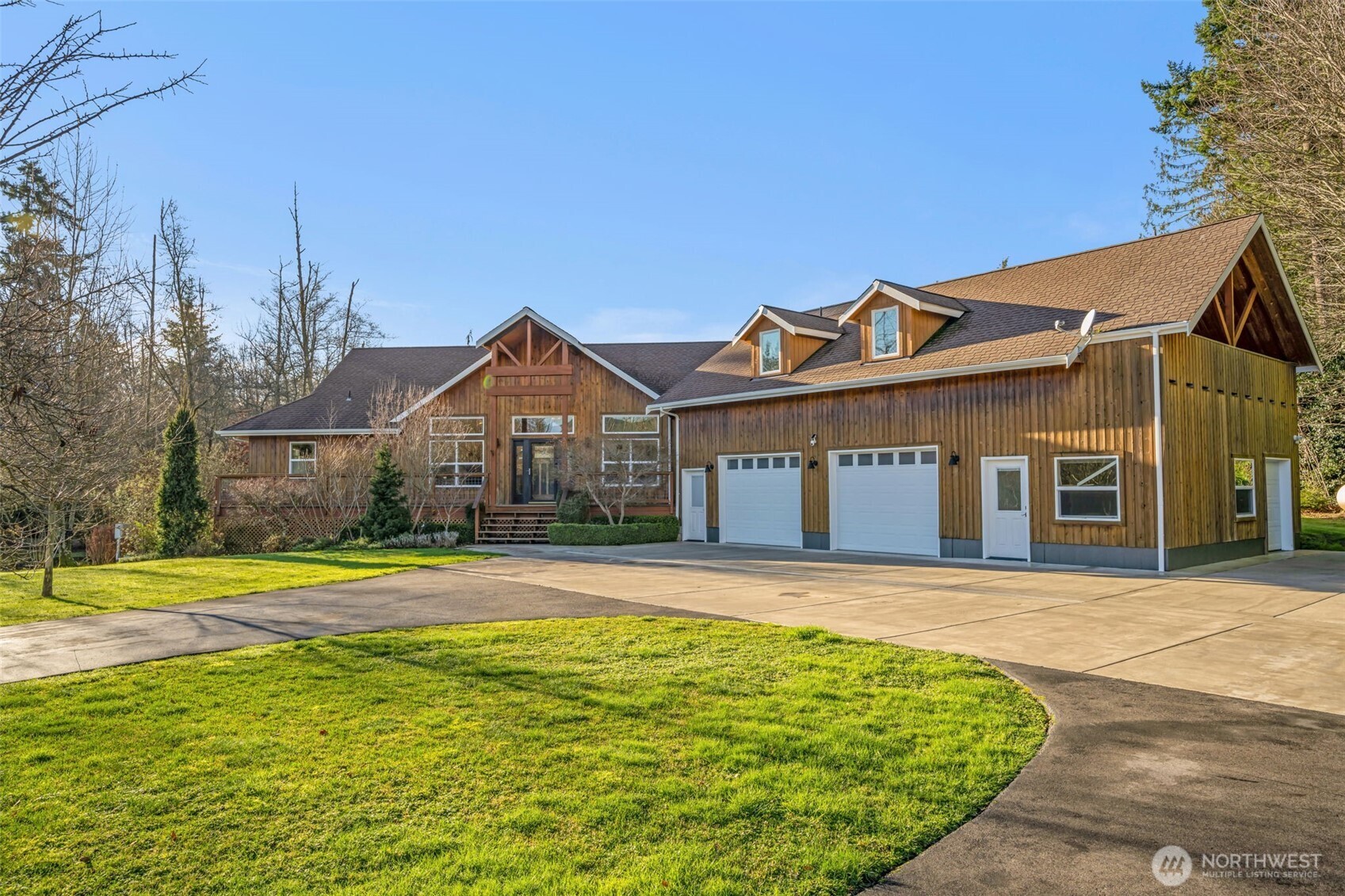 Rare 9.5+ acre sanctuary featuring a massive orchard, three ponds, and a 2,400 SF climate controlled greenhouse! Immerse yourself in a true "producer's paradise" with an expansive orchard featuring ~100 fruit-bearing trees—including crisp apples, sweet pears, plums, cherries, and figs. Complementing the orchard are ~65 thriving berry plants, ranging from raspberries and blueberries to unique marionberries, boysenberries, and goji berries.?? This upscale 2,800 SF home boasts radiant heat, a luxury primary suite, and ADU above garage for guests or rental potential. Explore private trails through old-growth woods or enjoy mountain views from your mahogany deck. Includes RV hookup with dump and plenty of shop space in the garage!  Your private homestead awaits!