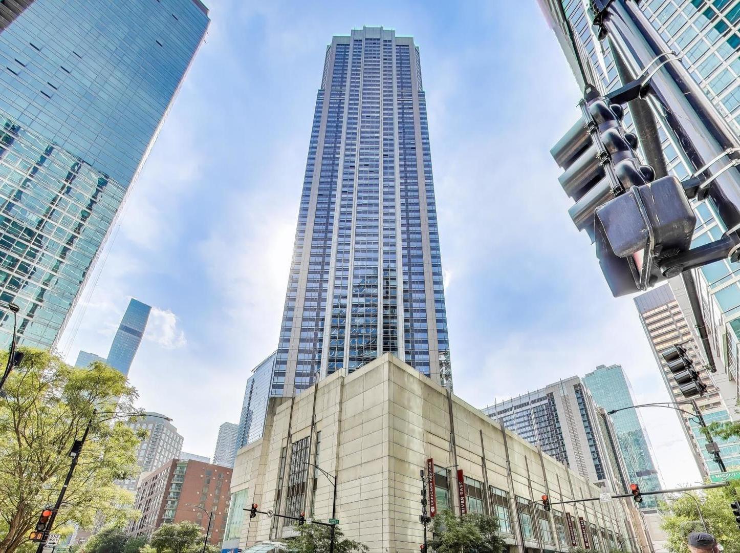 Outstanding Streeterville location in the stunning River East Building. Offering a spacious 2 bedroom, 2 bath condo on the 17th floor boasting 1,425 sq. ft. of living space with stunning skyline and lake views. Views of the iconic St. Regis Hotel and many other Buildings along with the Chicago River! This light-filled home features floor-to-ceiling windows with marble ledges for extra seating, hardwood floors, in-unit laundry, and generously sized bedrooms. The expansive master bedroom suite includes a large walk-in closet and private full bathroom. Enjoy a full-service building with 24-hour door staff, newly updated sundeck with four grills, fitness center, party room with kitchen, business center, and on-site management and engineer, Dry Cleaner, Bike Room and a Storage locker. Ideally located just steps from Northwestern Hospital, Bennett Park, Target, Starbucks, restaurants, Michigan Avenue, Navy Pier, beaches, grocery stores, AMC movie theater, Bowling Alley, Lake Michigan and the Chicago River. Assessments include Heat, AC, Cable, and Water. Garage parking available for rent.