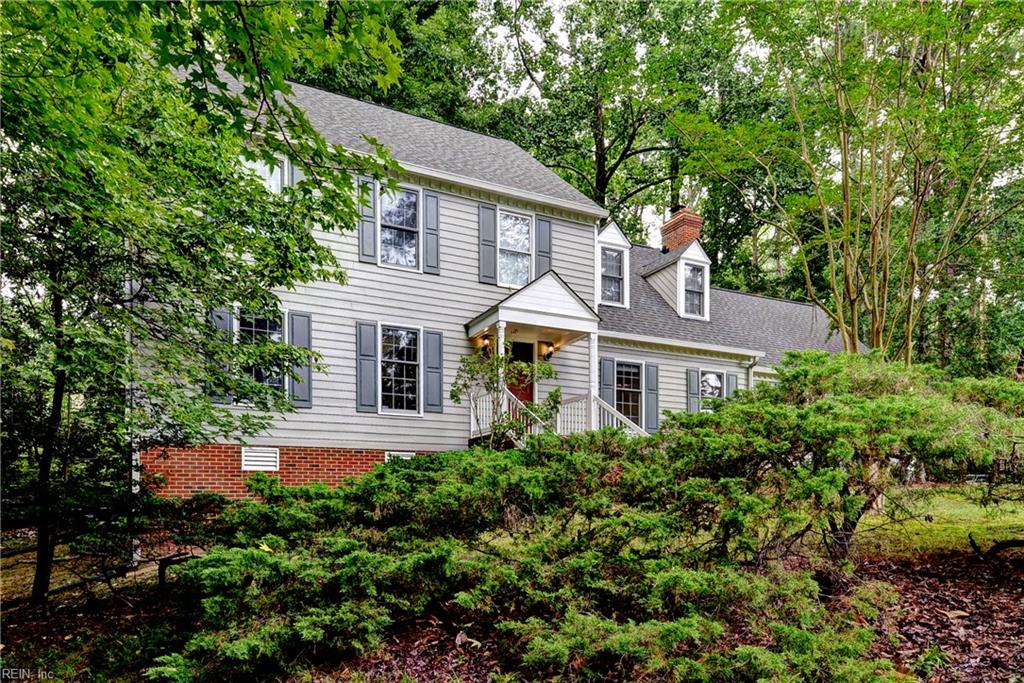 Lovely, well-kept, 4 Br, 2.5 Ba, Colonial style home with more space than you think! Recently updated with FRESH paint and NEW carpeting throughout! Recent NEW roof! Whole exterior has been power-washed! Set on a little over 1/3 acre w/ views across the street to Halfway Creek. Hrdwd flrs downstairs, masonry fplc in Fam Rm w/gas logs. Large, open Kit w/pantry, center island, and spacious Brkfst Rm w/bay window! Formal Liv and Din Rms w/chair rail and crown moldings! Large, open Fam Rm w/cstm built-in desk and bookcases, spacious ROG w/NEW ceiling fan, skylights, walk-in closet and under eave storage! Huge, upstairs primary Brm w/ensuite tiled Ba, 3 additional large Brms, spacious ceramic tiled hall bath w/skylight, upstairs laundry, and pull down stairs to attic storage. Huge back porch w/NEW fans is a sanctuary! Low maintenance yard, 2 car oversized garage, NEWER gas HVAC system w/NEWER gas hot water heater. Very private location and quiet street in Kingsmill!
