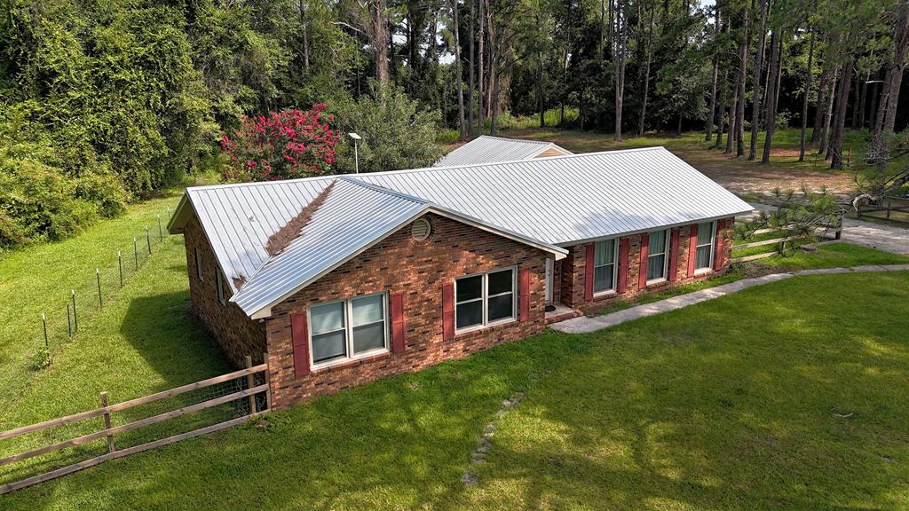 Easy living in Pelham, Ga.  This well-maintained single-story home offers comfort & convenience. The layout is filled with natural light and spacious living areas. Large kitchen is plenty of room for family & friends when entertaining for the holidays or just because. Metal roof, lots of room, barn & much, much more! Minutes from Pelham, Thomasville & major employers.