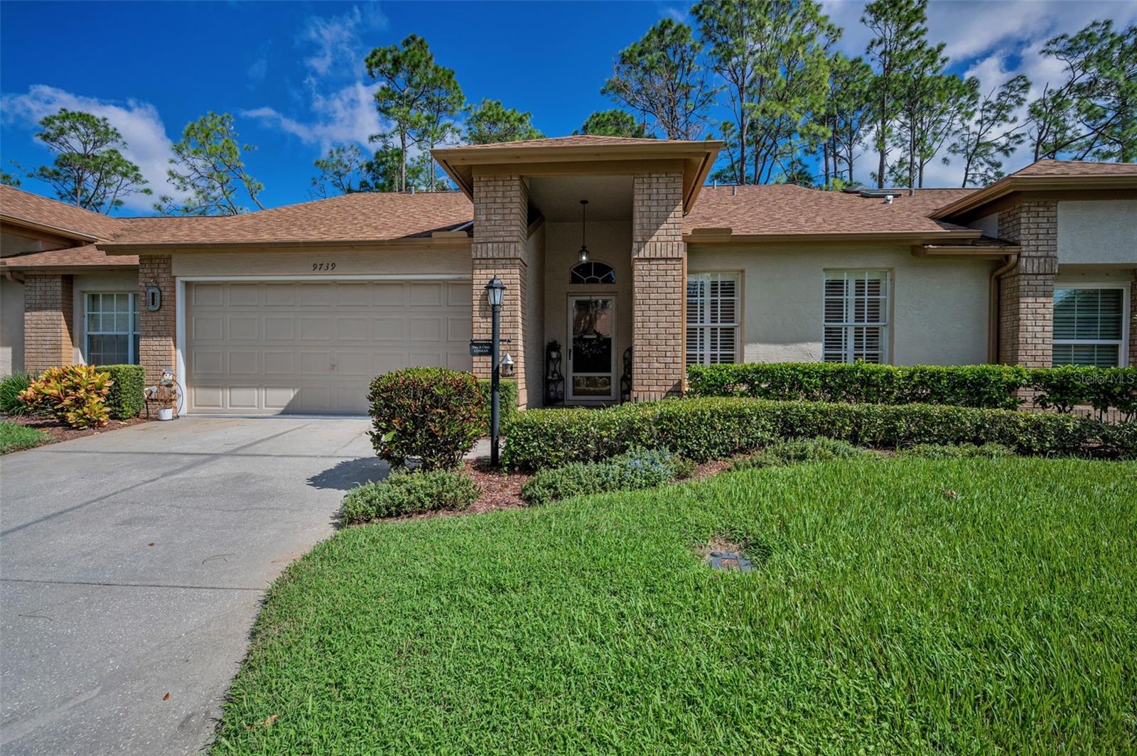 IN TIMBER GREENS ON THE GOLF COURSE OVERLOOKING THE 11TH FAIRWAY. This 2-bedroom 2 bath 2 car garage Villa, has updated flooring flowing through-out home. Kitchen with granite and wood cabinets. Plantation shutters and ceiling fans. The A/C unit is 2022. The Primary bedroom with Walkin closets and primary bath with Dual sinks. Sliding doors leading to the Screened Enclosed Lanai overlooking the Golf course. Inside Laundry room with washer and dryer. Timber Greens offers an exceptional lifestyle with lots of amenities including an 18-hole par 71 golf course, clubhouse, pro shop, community pool and spa, pickleball and tennis courts, bocce, shuffleboard, art and crafts activities, and the popular 19th hole bar and grill. Enjoy the vibrant community atmosphere while being just minutes away from all the essentials. Conveniently located, you’ll find shopping, dining, and nature parks close at hand. This home is perfect for those looking to embrace a friendly community with endless recreational opportunities. Don’t miss out on this opportunity—come see your new home today! Schedule a viewing and explore the wonderful lifestyle that awaits you. This home comes mostly furnished with the exception of a few items.