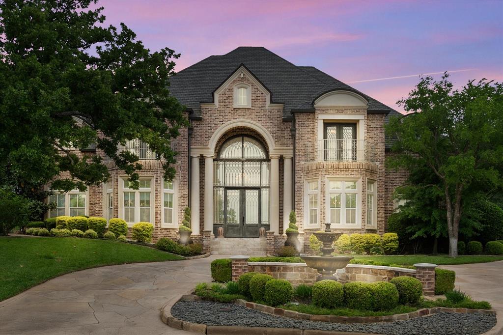 Welcome to this meticulously maintained residence in one of Arlington’s most sought after areas. This stunning home offers luxury living on a spacious landscaped .86 acre lot within an exclusive 9-acre community featuring 2 ponds, walking trails and a basketball court. Designed for refined living and seamless entertaining, this four-bedroom four and a half bath home exudes sophistication and comfort at every turn. The spacious living areas are enhanced by natural light, high ceilings and elegant finishes. Travertine and engineered wood flooring throughout, multiple living areas and a bar upstairs—ideal for entertaining. The home includes two primary suites offering flexible living options. Enjoy a beautifully landscaped backyard with several seating areas, a covered patio with built-in grill, built in heaters and motorized shades for year round comfort. The heated pool and hot tub are surrounded by a full-yard surround sound system creating a true outdoor retreat. This is a rare opportunity to own a luxury home in a prime Arlington location within a gated community where elegance and lifestyle come together.