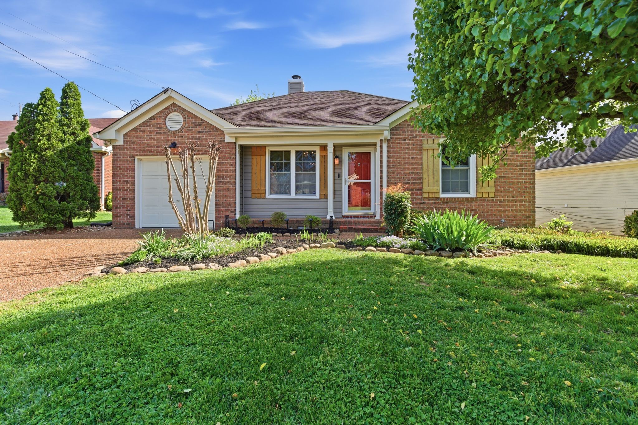 Move-in ready and full of charm! This beautifully updated one-level home offers 3 bedrooms, 2 full baths, and approximately 1,390 square feet of comfortable living space. You'll love the newly refinished Tennessee grown hickory hardwood floors, and cozy wood-burning fireplace in the living room. Interior has been freshly painted. The heated and cooled sunroom provides the perfect bonus space for relaxing, working from home, or entertaining guests year-round. Additional upgrades include Pella replacement windows, RainSoft whole-house water purification system and updated lighting and dimmer switches throughout the house. Window treatments include top down/bottom up double cell blinds in all windows except for plantation blinds in kitchen. Seller is leaving Eufy camera system, (3 outside and 2 inside) and the shelving in garage if buyer would like to keep. Community has access to clubhouse, pool, playground, and dog park. Walk or bike to nearby restaurants, coffee shop, pharmacy, and movie theater. Conveniently located in Hendersonville on a low-maintenance lot, this home offers comfort, updates, and value all in one. Don't miss this opportunity!