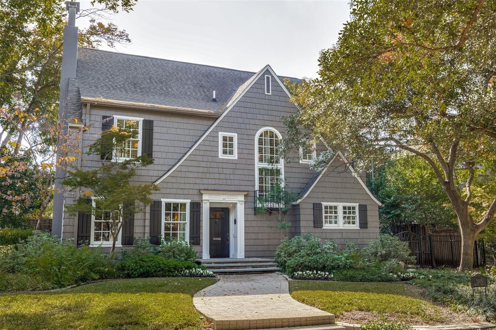 Classic New England Cape Cod–style home originally designed by Fooshee & Cheek. Beautifully updated while honoring its historic character, this five-bedroom, four-and-a-half-bath residence offers an ideal balance of timeless elegance and modern livability. The main level features formal living and dining rooms, a private study, and a warm, inviting family room perfect for everyday living and entertaining. The updated kitchen showcases white marble countertops, stainless steel appliances, and picturesque views of the pool.The primary suite is located on the second floor and offers serene treetop views. Two additional bedrooms with en-suite baths complete the second level. The third floor includes two bedrooms and a full bath, with one bedroom easily adaptable as flexible space for a gym, playroom, or media room.Outdoors, the private backyard features a sparkling pool, guest quarters, multiple seating areas, grassy play space, and a detached two-car garage with alley access. Ideally located within walking distance to Armstrong Elementary, McCullough Middle School, and Highland Park Village.