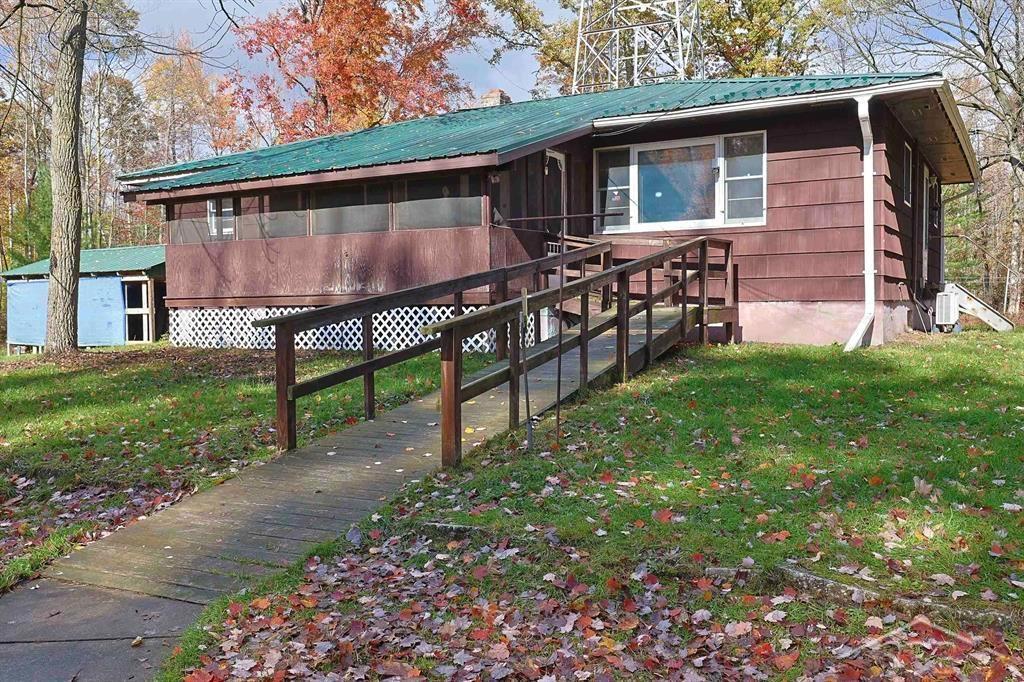 CHARMING ON CHIPPEWA RIVER ROAD! This amazing 59 acre property is only 13 miles from Midland, 16 miles from Mt Pleasant and features a 1350 sqft ranch style home with 3 bedrooms and 2 full bathrooms. The primary bedroom has an en-suite bathroom. Set on a full basement you will enjoy alot of options and flexibility for additional space. The hardwood floors need a little love, but no doubt you can make them shine. There is a wood stove in the basement along with a forced air furnace that was installed just a few years ago. A mini split adds A/C to the first floor for comfort and there is a Generac generator for backup power. The house is plumbed for first floor laundry and laundry in the lower level. The 59 acres of hard and soft woods that is teeming with wildlife. Also outdoors you'll find multiple outbuilding including; 35x25 barn, 40x18 horse barn, 14x30 woodshed, 10x8 chicken coup, and 12x16 shed. This would make a great deer camp!