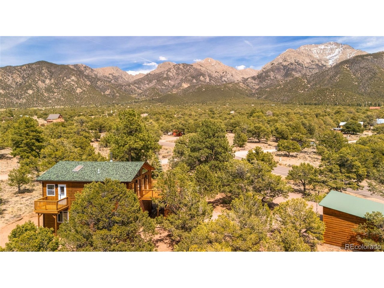 Tucked away in the foothills of the Sangre De Cristo Mountains, this completely remodeled home is a large 1440 sq ft 3 bed/2 ba home with 1 car garage. An expansive, newly installed wrap-around deck greets you as you enter the new French doors into kitchen/dining space on the second floor. Situated above tree level, the views are vast in all directions, with towering mountains to the north, and the sprawling valley to the south, and backing hundreds of protected acres so neighbors will never obscure your view and privacy. New granite countertops complement the new stainless appliances, providing ample space to cook and dine while enjoying the dramatic Colorado sunsets. The home is heated with a new forced air propane system complimented by a recently insulated crawl space, and upstairs is complemented by a wood stove/oven/range. With new quality vinyl floors throughout the top floor, cleanup is a breeze. Primary bath features all new sink/toilet, and fixtures and tub/shower combo. The large, light filled primary bedroom includes an ample double closet, overhead skylights, as well as a private balcony overlooking the quiet forest beyond the house, as well as separate access to the larger balcony. in the newly carpeted downstairs, a versatile and bright flex room connects the two sizable bedrooms, each of which feel enveloped in the forest surrounding the home. T&G pine ceilings dampen the noise between floors, and the abundant windows draw in the natural environment throughout the home. Downstairs bathroom also features full tub/shower combo with new granite-topped vanity/sink and new toilet. Outside the downstairs French doors, extensive gravel work has been installed to make driving in any weather situation a breeze. The single car, automatic door garage includes a poured slab, floor drain and electricity, perfect for a variety of uses. Make sure to check out the Matterport tour to truly get a sense of the many incredible features of this beautiful Crestone home!