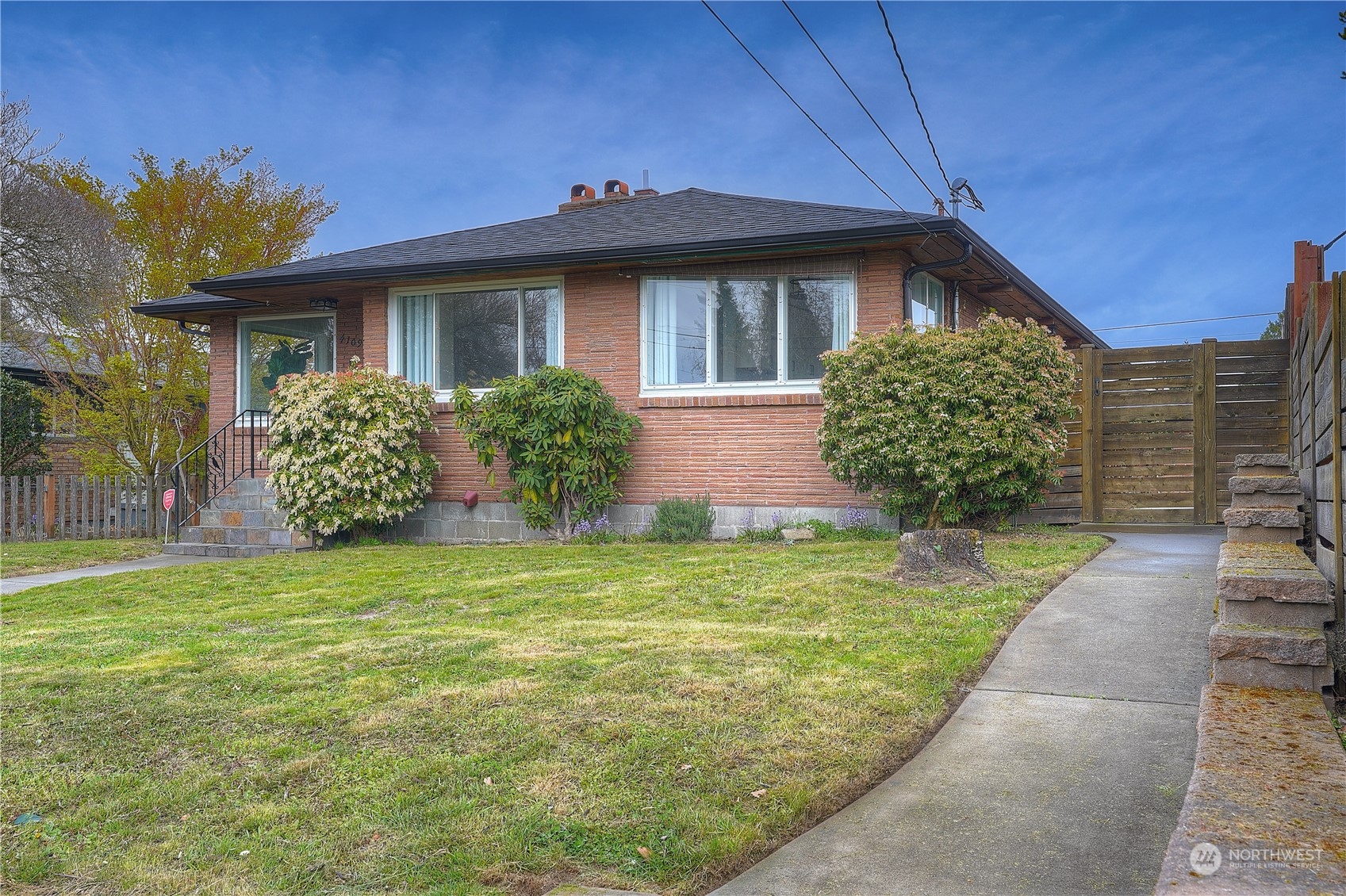"Bank Approved Price." Generous living & North Tacoma convenience await! This brick beauty shows off a classic 1950s exterior, & inside you’ll find modern style at its finest. Bright & cheerful spaces shine like new. Gather in welcoming open-concept living/dining area & enjoy sizable, impeccably curated kitchen w/ample storage. Discover versatility w/2 bedrooms on main level & 2 bedrooms in fully finished basement, along w/comfortable living area. Laundry room includes plenty of storage. Fenced yard features patio, sprinkler system & opportunities for gardening! RV parking & detached garage off alley. Jane Clark Park ready for fun & play down the street & schools close by. Close to Ruston Way waterfront, Pt Ruston, & North Tacoma amenities.