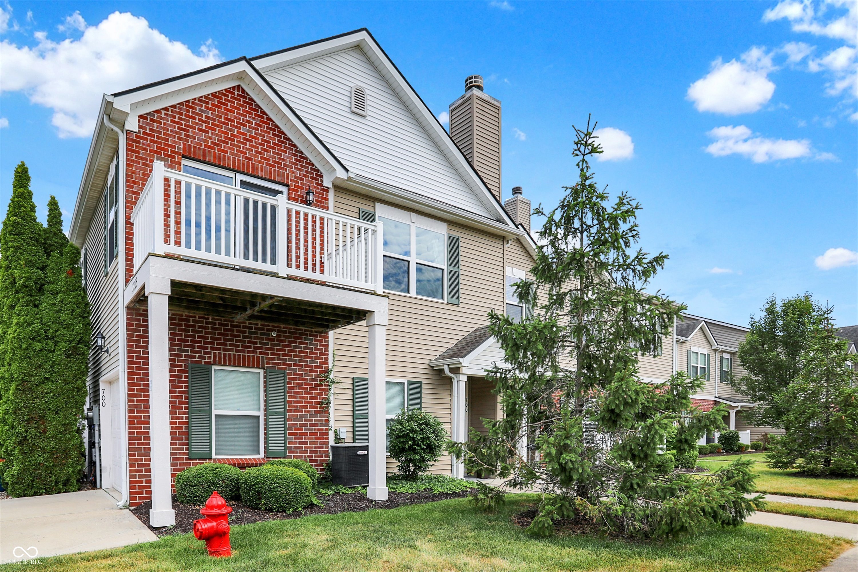 Nestled on the edge of Limestone Springs with serene pond views, this light-filled 2-bedroom, 1-bath condo offers privacy and modern comfort. The open-concept great room features vaulted ceilings and a cozy fireplace, flowing seamlessly into a spacious eat-in kitchen equipped with full appliances, a pantry, and direct access to the deck. The oversized primary bedroom boasts a massive walk-in closet and private entry to the full bath, while the generous second bedroom is prewired for overhead lighting. A convenient laundry/utility room adds practicality, and community amenities include a pool, clubhouse with fitness center, playground, and sand volleyball court. With easy access to I-69 and just minutes from Hamilton Town Center's shopping and dining, this home blends peaceful living with everyday convenience.