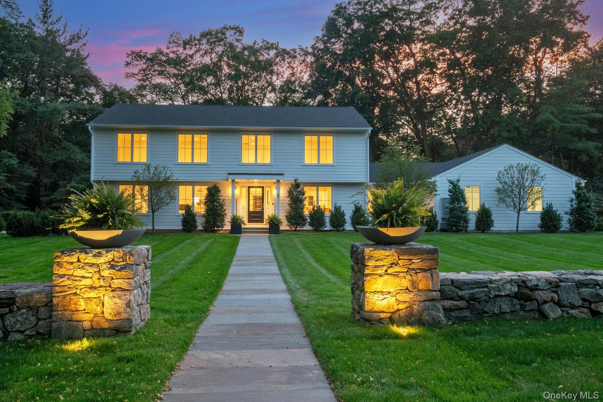 Elegant Colonial with Pool on Cul-de-Sac in Armonk (Byram Hills Schools)
Located on a quiet cul-de-sac, this expanded and updated Colonial sits on a level, landscaped acre with a heated in-ground pool, stone patio, and fenced yard. Oversized windows fill the home with light, showcasing wide-plank wood floors and high-end finishes.
The chef’s kitchen features marble counters, custom cabinetry, and top appliances. The spacious primary suite includes a luxurious bath with radiant heat, soaking tub, and oversized shower.
Lives like a 4-bedroom with a flexible first-floor guest room/office. Finished walk-out lower level (~950 sf) opens to the pool area. Approx. 4,100 sf above grade. Oversized 3-car garage, outfitted closets, and full-house Generac generator complete the package.