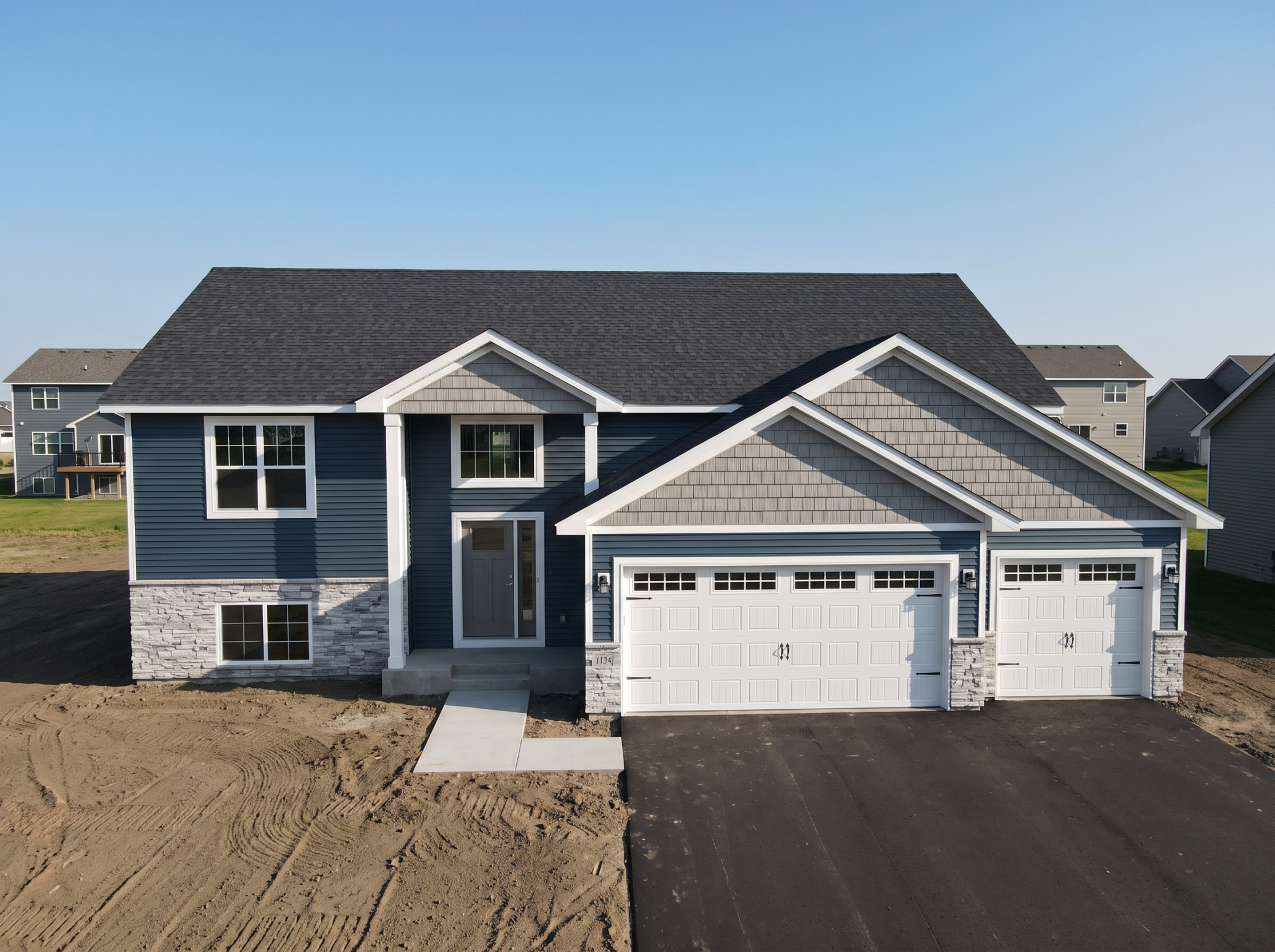 This brand new 5 bedroom, 3 bathroom, 2-car garage home features an open floor plan and a vaulted ceiling in the living, dining, and kitchen. The kitchen boasts laminate floors, dark cabinets, an island, pantry, granite countertops, and upgraded stainless steel appliances. The owners suite includes a private bathroom. The finished walk out lower level offers a family room, two additional bedrooms, and a full bathroom. The property is perfect for those who are looking for a brand new home with plenty of space and modern features. Don't miss your chance to own this fantastic property!