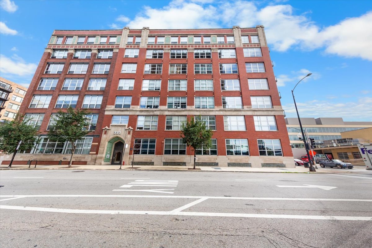 Absolutely STUNNING timber loft corner unit with soaring 11 foot ceilings that has been updated from top to bottom in the most spectacular manner!  Enter into the spacious foyer with brand new Rejuvenation light fixture and make your way down the hall into the enormous living dining space with both North & East exposure through two full walls of windows.  The kitchen was completely reimagined last year and is a true show stopper in an already beautiful space.  Brand new Santorini White Quartzite countertops and backsplash including the double waterfall edges on the oversized kitchen island.  Thermador fridge & dishwasher, new Jennair oven/stovetop, LG microwave that doubles as an air fryer, and brand new Monogram wine/beverage fridge.  Custom cabinets complete with West Elm knobs, CB2 pulls, and both under and over mount LED lighting. Restoration hardware fixture added to the dining space and brand new Crate & Barrel fixture in the living space.  Extra wide private balcony is directly off the living space as well perfect for a cup of coffee in the morning or grilling with your favorite beverage after work.  Primary king sized ensuite bedroom with huge walk in closet that includes all new custom closet organizers along with automatic lighting that turns on as you enter and turns off as you exit.  Massive ensuite bathroom with brand new lighting, mirrors and wallpaper along with new CB2 cabinetry pulls.  Guest bedroom is large enough for spacious guest bed, nightstands, and work from home desk/area.  Guest bathroom fully updated with new lighting, wallpaper, and fixtures.  Other updates include Siri and smart home compatible Smartwing shades on all windows and patio doors, Phillips SmartHue lighting throughout with ability to change lighting with smartphone, Explore Hardware knobs, door handles, and hinges throughout, and a brand new Samsung smart washer/dryer.  Enormous double, full height storage cage in the basement comes with the unit and a private deeded parking spot is available for an additional $30k.  Too many updates to list in the remarks and is a space that must be seen in person to truly appreciate the attention to detail.  Just blocks from the West Loop, UIC, Union Station, Blue Line, Medical District, The Loop, and access to all major highways.  A true Chicago Loft, done to perfection!