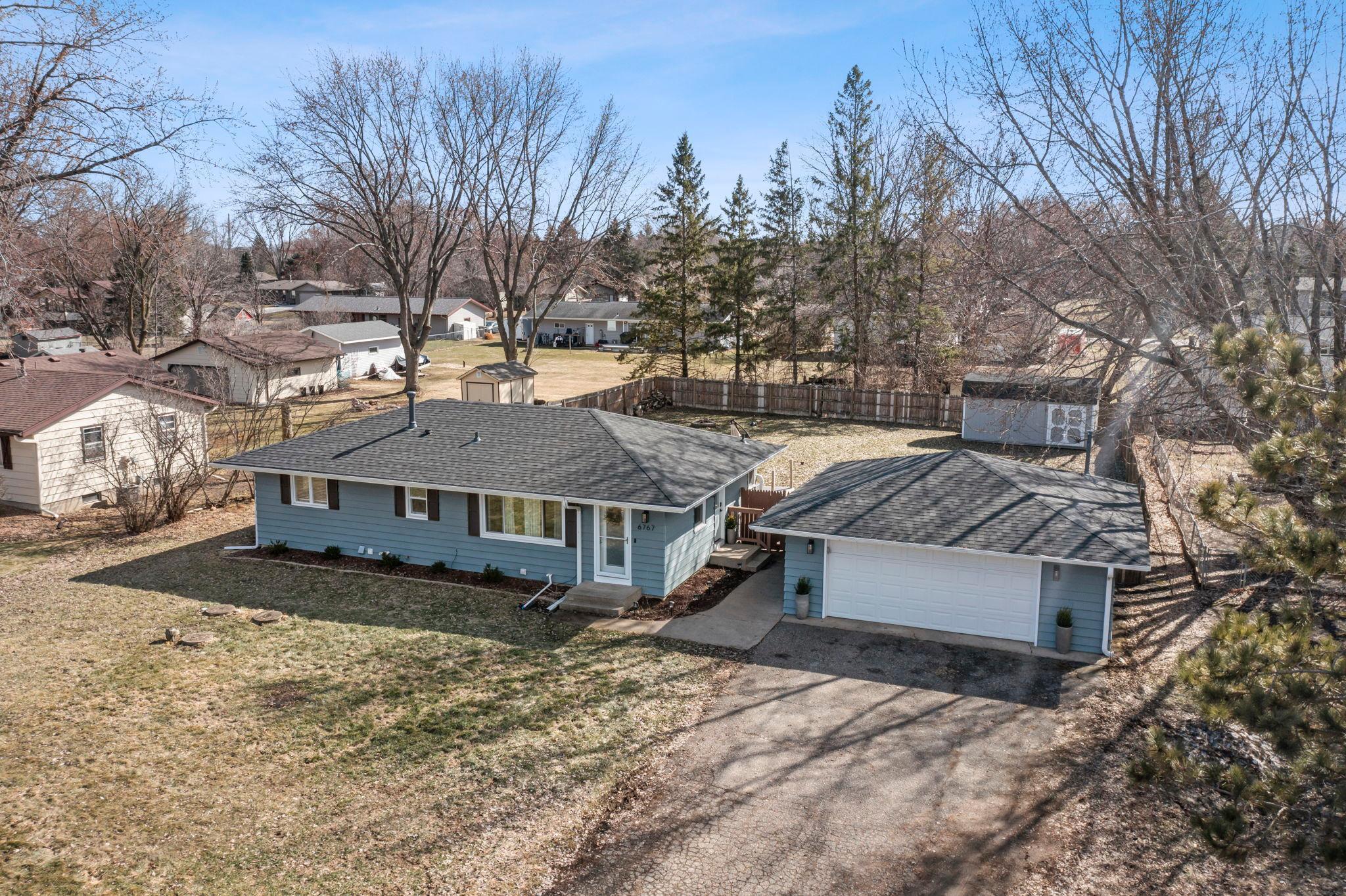 Welcome to this charming, well-maintained 3-bedroom, 2-bath home in a quiet Prior Lake neighborhood. The bright open-concept main floor features walnut hardwood floors, a wood accent wall, and a spacious living room filled with natural light. The kitchen offers white cabinetry, granite countertops, stainless steel appliances, and flows into an informal dining area with access to a large deck—perfect for entertaining.The main level includes three bedrooms and a full bathroom, while the finished lower level offers a spacious family room, versatile bonus room ideal for an office, gym, or playroom, and a ¾ bathroom with a tiled walk-in shower. Enjoy the fully fenced backyard with a firepit, large 20x10 storage shed, and a two-car detached garage with a new heater. Conveniently located near parks, shopping, restaurants, and major highways. Recent updates include new dishwasher (2023), roof (2023), septic pump (2026), and garage heater.