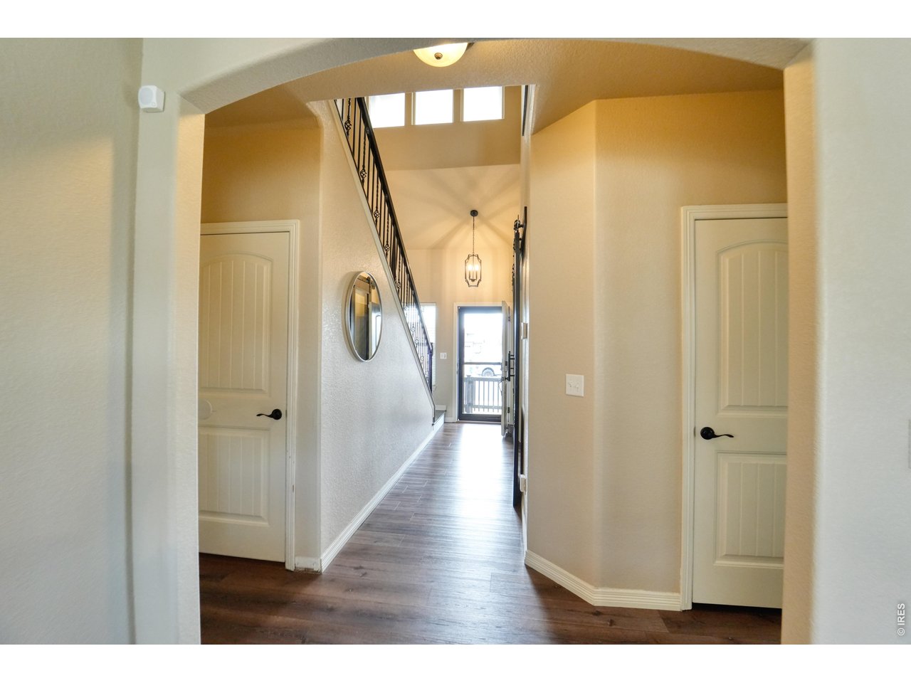 Spacious home located in North Loveland with everything you've been looking for! This home features a huge luxury primary suite with a his and hers closet, a beautiful open-concept kitchen with upgraded finishes, and a finished basement. This home has plenty of room for everyone. Situated on a desirable corner lot with mountain views and directly across from a neighborhood park, the location is hard to beat. Enjoy a large 4-car garage with workbench and Tesla charger in 3rd garage bay, inviting outdoor living space, storage shed in backyard and a dedicated office-so none of the six bedrooms have to be sacrificed for working from home. To top it off, this wonderful home is conveniently located with easy access to both Loveland and Fort Collins. New exterior paint (2025), new water heater (2025), LED HVAC sanitizer. Assumable VA loan!