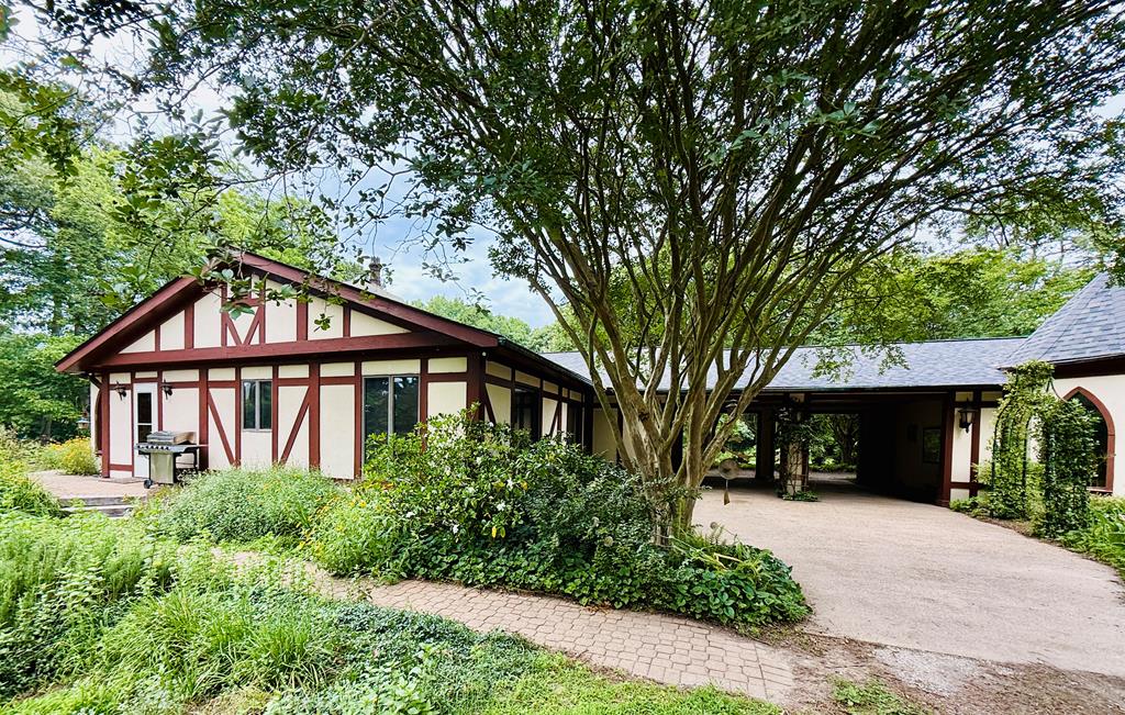 A unique opportunity to live in a magical & whimsical setting. This Tudor-style home on Lake Allure offers an enchanting atmosphere, surrounded by the lake's gentle shores & beautiful landscaping. For anyone seeking a special retreat to unlock their creativity, this is the perfect place. Conveniently located near Norfolk/ Virginia Beach,  a short drive from historic Cape Charles, this one-level, three-bedroom home with an additional detached guest suite provides all the modern comforts. It has undergone recent extensive renovations Recently listed on Airbnb, it has generated substantial rental income with the main house &  guest home rented separately. For Summer recreation, Kiptopeke State Park is just a few miles away, offering sandy beach, boat ramp,  fishing pier, & walking trails.