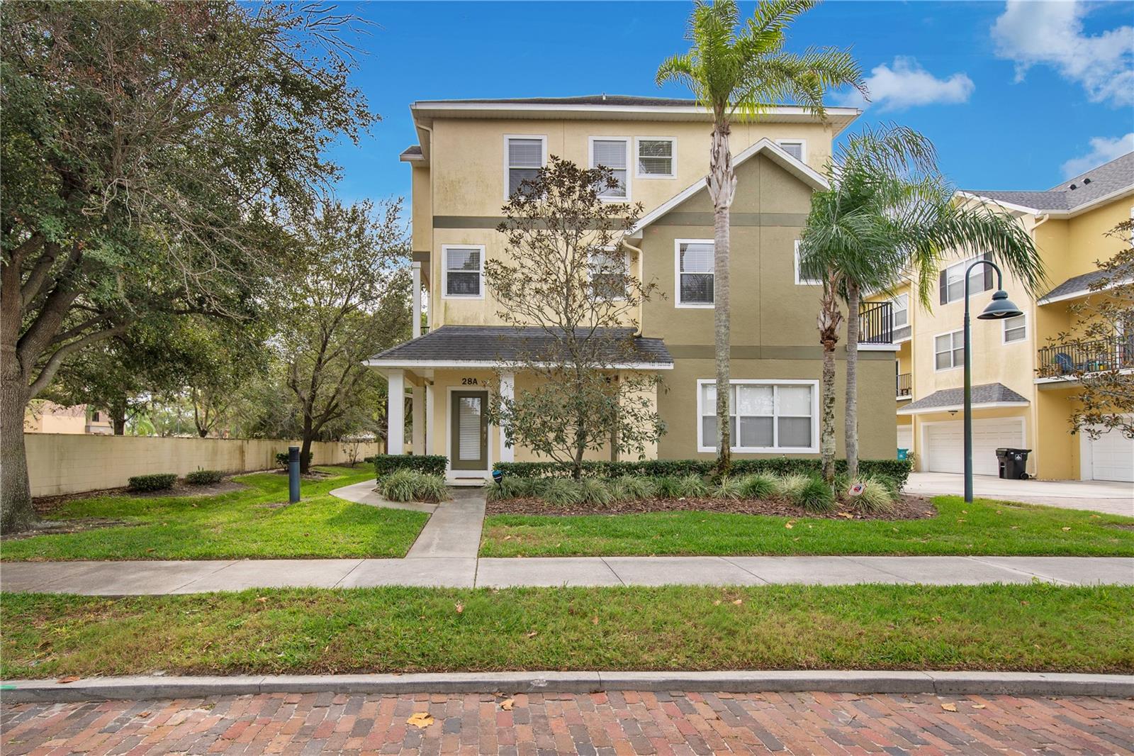 BELOW BANK RATE SELLER FINANCING AVAILABLE! Welcome to this beautifully updated 3 bedroom, 2.5 bathroom, 2 car garage end-unit townhome, a true gem in Orlando's vibrant SODO district. This light-filled home boasts twelve additional windows, ensuring a bright and airy atmosphere. Uniquely positioned, it offers extra space and privacy, with no direct neighbors across the street. Upon entering, you're greeted by a versatile room on the ground floor, perfect as a bedroom or a home office. The heart of the home is on the second floor, featuring a spacious open-plan kitchen and living area. The kitchen, with its porcelain wood-effect flooring, flows seamlessly into the living space, making it ideal for both relaxation and entertaining. Two outdoor balconies provide a serene spot for your morning coffee or an evening glass of wine. This level also includes a spacious dining room and a convenient half bathroom. The top floor is dedicated to comfort and privacy, hosting two expansive double master bedrooms, each with its own full bathroom and walk-in closet. Here you'll also find a laundry closet (with washer and dryer) and a linen closet add to the functionality of this space. Energy efficiency is key in this home, highlighted by a new top-of-the-line Trane A/C unit, with a 10-year warranty. Location is everything, and this home is centrally located in Orlando’s SODO district. Just blocks away are a Super Target, LA Fitness, Neighborhood Walmart, and two Publix grocery stores. Enjoy close proximity to downtown Orlando, Thornton Park, Lake Eola, top restaurants, bars, shopping, Dr. Phillips Performing Arts Center, and the main campus of Orlando Health is only three blocks away. It's also a short drive to major attractions and easy access to highways. Wadeview Park, with its heated swimming pool and tennis courts, is just a ten-minute walk away. Enjoy low maintenance living as the condo association takes care of exterior landscaping, façade, roof, sprinkler system, property insurance, pest control, and more. This townhouse is not just a home; it's a lifestyle so schedule your private showing today!