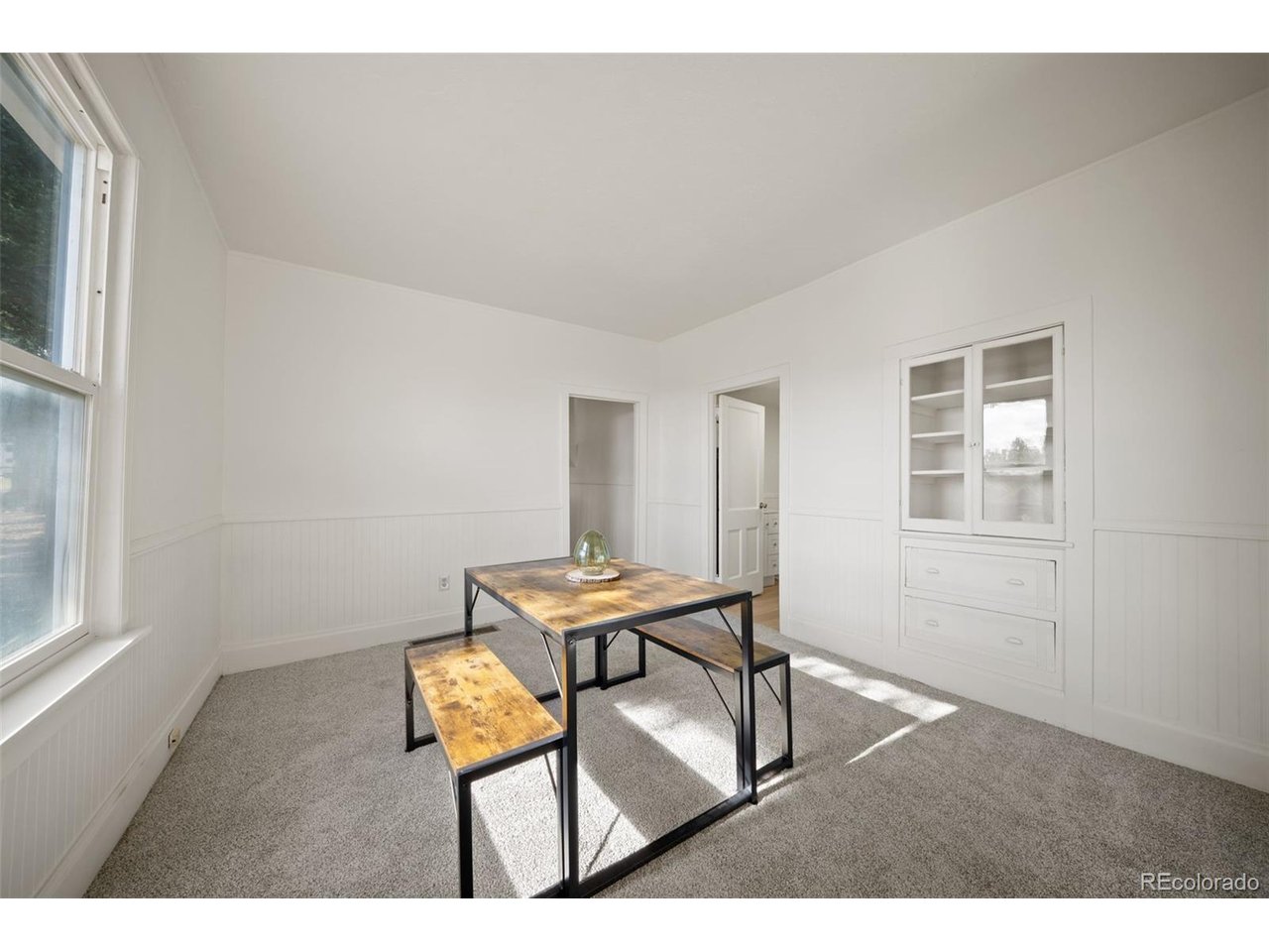 Completely renovated, this beautifully updated Cripple Creek home combines modern finishes with timeless charm in a convenient location just minutes from historic downtown. Thoughtfully remodeled from top to bottom, this inviting home features a bright, open interior with fresh paint, brand new flooring, and abundant natural light throughout. The fully updated kitchen is equipped with all new appliances, while the remodeled bathroom offers contemporary finishes and includes the convenience of an in-home washer and dryer. Major improvements provide peace of mind for years to come, including a new roof, reinforced foundation, new siding, furnace, water heater, new electrical panel, new electrical service from the utility pole to the breaker panel, plumbing updates where needed, and all but two windows replaced approximately 10 years ago. The foundation reinforcement was completed using in-house engineering and did not require a permit. The home's plumbing was substantially replaced approximately 16 years ago, with the recent updates limited to fixtures and finish improvements. Electrical wiring was updated where needed as part of the renovation. Every detail has been thoughtfully updated, making this a truly turnkey property. The cozy enclosed front porch offers the perfect spot to enjoy your morning coffee or unwind after a day exploring the area. Outside, the spacious lot and storage shed provide room for gardening, entertaining, or simply enjoying the mountain air, while off-street parking adds everyday convenience. This home borders a double lot next door with mature trees, providing additional privacy. Located just moments from the restaurants, casinos, shopping, and year-round events of historic downtown Cripple Creek, this home is ideal as a full-time residence, mountain getaway, or investment property. With extensive renovations already complete, all that's left to do is move in and enjoy everything this charming mountain community has to offer.