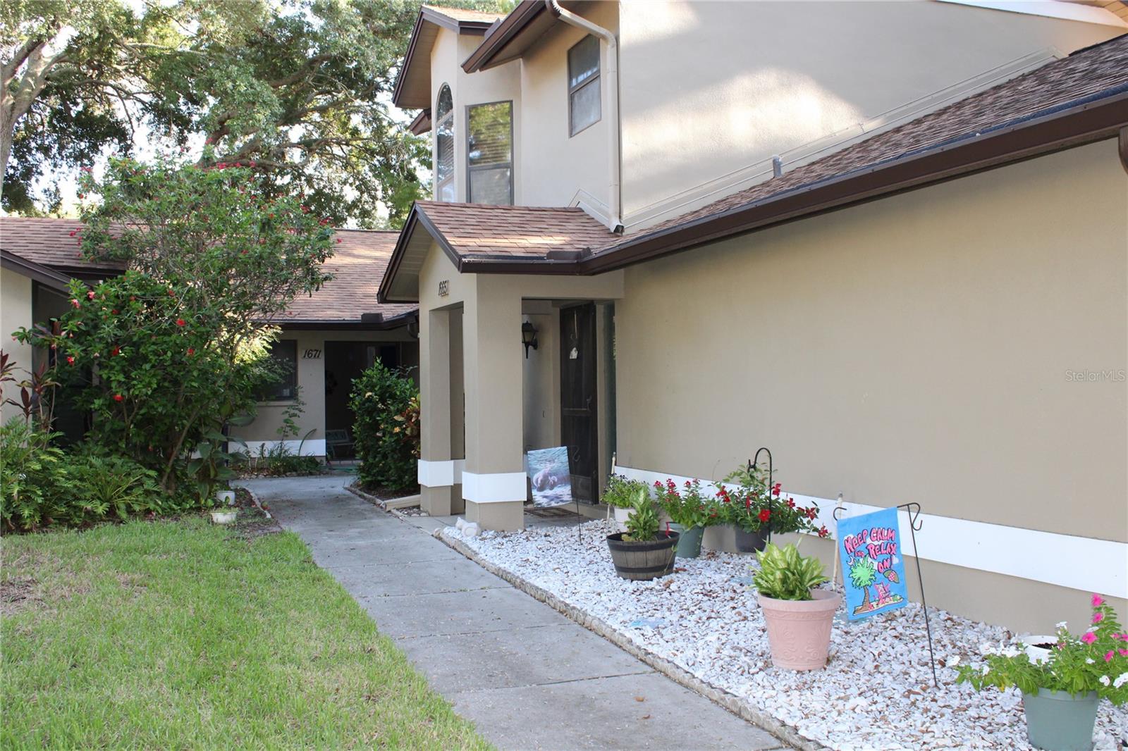 Welcome to your Dunedin Florida beautiful home. This villa offers soaring ceilings, remodeled kitchen, beautiful tiled bathrooms and a private one car garage. Your 12 by 10 foot enclosed Lanai. Overlooks a nice private courtyard, full of mature trees and beautiful bushes. It’s beautiful how the streets wind and curve through the Oaktree filled neighborhood. Take a stroll down to your grand clubhouse. Where you’ll have a heated pool, full kitchen, large screen TV, a library, bumper ball pool table. Great place for large get-togethers and meeting all your neighbors. You’ll love your community, just minutes to the heart of Dunedin. The waterfront city of Dunedin offers some of the best restaurants and breweries in Pinellas County Florida. There’s a tremendous waterfront Marina to store you boat. They also have boats to rent, fishing charters, sunset cruise’s and much more. Also very close to our Pinellas County beautiful beach’s. Just an absolute wonderful town. Which host weekend festivals, great breweries and shopping. If you enjoy baseball. You community’s East property-line backs up to the Blue Jays training field. Walk over and catch a game. If you’re looking to live in one of Florida’s finest beach areas. Make an appointment today to see this beautiful villa!!!