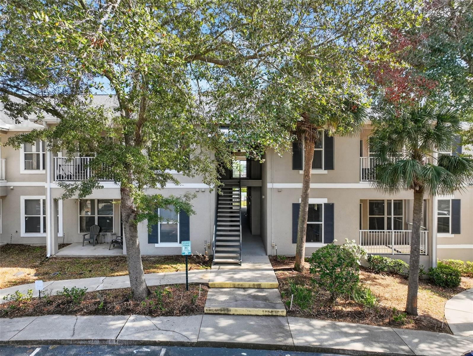 One or more photo(s) has been virtually staged. Welcome home to Southern Dunes Golf & Country Club, a 24-hour guard-gated golf community known for its championship golf course, rolling terrain, and well-maintained surroundings. This corner, ground-floor condominium offers a unique advantage: while classified as ground level, the unit is elevated above street grade, providing added privacy and security while maintaining convenient, stair-free access.The interior features of this well-maintained unit include an open and functional layout with connected living and dining spaces, creating a comfortable flow for everyday living. The kitchen features white shaker-style cabinetry with soft-closing doors, stainless steel appliances, ample counter space, and 42-inch upper cabinets for added storage and an elegant appearance. The kitchen and interior laundry room are enhanced with detailed tile flooring, adding durability and a refined design element to these high-use spaces.A split-bedroom floor plan allows for privacy and flexibility. The primary bedroom is filled with natural light and includes a walk-in closet and a private en-suite bathroom. The secondary bedroom also features a walk-in closet and is conveniently located near a full second bathroom, ideal for guests or additional occupants.Additional features include an interior laundry room and a private exterior storage closet at the unit entrance, suitable for golf equipment, outdoor gear, or seasonal storage.Enjoy outdoor living from the covered and screened rear lanai, elevated and overlooking the interior of the community. The unit is located just steps from the clubhouse, fitness center, tennis courts, resort-style pool, and playground, offering easy access to community amenities.Southern Dunes is home to a championship 18-hole golf course, mature landscaping, and the on-site Tavern on the Dunes restaurant. Conveniently located off Highway 27, the community offers close proximity to shopping and dining, including a Walmart Supercenter within walking distance, nearby Publix and Aldi, and additional retail options. A Target is located within approximately five miles, with a new Target currently under development less than two miles away, reflecting continued growth in the Haines City area.This property is suitable for a primary residence, second home, or investment opportunity, offering comfort, convenience, and access to one of Central Florida's most established golf communities. The community is conveniently located near medical facilities, including AdventHealth Heart of Florida, Walt Disney World, and major Central Florida attractions are a short drive away, approximately a 5 7 minute drive, along with nearby urgent care centers and medical offices. The property also offers close proximity to public and private schools serving the Haines City community, as well as Lake Eva Park. Centrally located between Orlando and Tampa, providing convenient access to both major metropolitan areas.