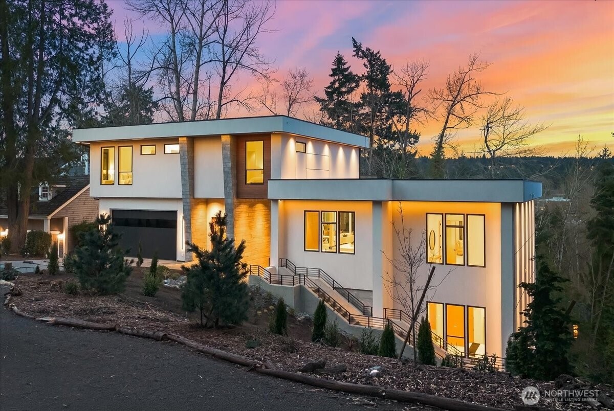 Set in the coveted enclave of Yarrow Point, just moments from the greater Seattle area, this exceptional custom residence with  lake views offers a living experience more akin to a private five-star retreat. Thoughtfully designed with striking architecture and elevated finishes, it blends global luxury with the natural beauty of the Pacific Northwest. Western exposure paired with breathtaking eastern sunrises fills the home with ever-changing light.    A natural stone entry opens to soaring ceilings and wide plank white oak floors, anchored by a translucent backlit marble fireplace. Architectural linear lighting and crystal chandeliers create a refined yet inviting atmosphere. A 14-foot NanaWall connects seamlessly to a 500-square-foot covered deck with a wind-rated automatic screen, delivering effortless indoor-outdoor living.      The kitchen features Wolf and Thermador appliances, custom cabinetry with integrated lighting. A temperature-controlled wine room and expansive theatre elevate both entertaining and everyday living.    Upstairs, the primary suite offers Italian porcelain slab finishes, a backlit marble niche, spa-inspired smart showers, and a private deck. Fully networked and powered by a Control4 smart system, this home offers effortless control, privacy, and prestige. Outdoors, fireplaces, fire pits, and a one-of-a-kind breezeway beneath the home complete this rare offering.    This is not just a home—it’s a statement, come see for yourself!