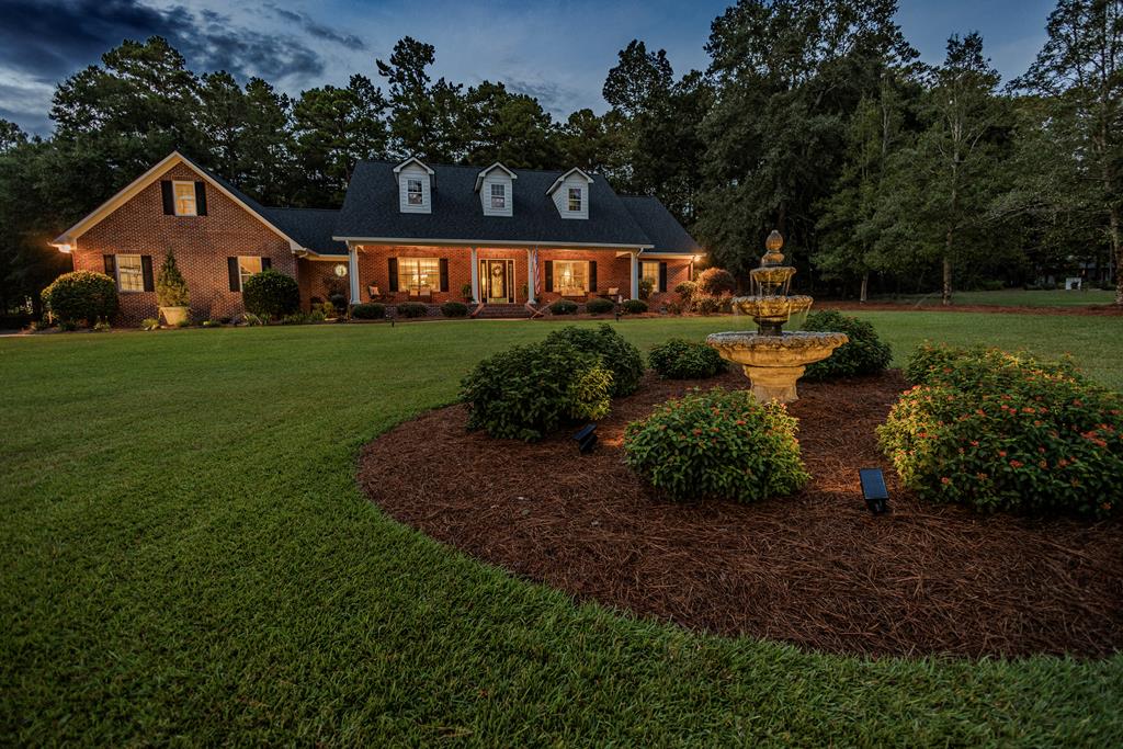 Just South of charming Thomasville and only minutes from vibrant Tallahassee, this custom built beauty sits in a welcoming neighborhood full of fine folks and Southern Charm. Lake view brick and hardy board home with fabulous floor plan was custom built in 2005. Home has 3 bedrooms and 3 baths, kitchen has custom maple cabinets with Quartz countertops, the appliances include a gas cook top, GE Profile refrigerator, custom island with prep sink and garbage disposal. The bathrooms and laundry room have custom cabinetry and tile flooring. Living room with vaulted ceiling and lovely fireplace with gas logs, gorgeous hardwood flooring and open floor plan with room for entertaining. Hall is 5 feet wide with additional closet space. Home has 2 AC units with one 3 1/2 ton unit brand new in 2022. New roof in 2021. Finished bonus room with 450 sq. ft. is heated, cooled and plumbed, it is accessible with stairs inside garage along with a 1Sx20 storage room. Primary bath has a Jacuzzi tub, custom shower and "his and her" vanities, Primary bedroom has a large custom closet, second bathroom also has a custom shower. Front porch has brick pavers. Established beautiful landscaping with irrigation, concrete walkway to front of home. Large patio for entertaining, seamless gutter system. Inside the main garage is a nice storage area, this side holds 2 vehicles. The second attached garage includes room for 1 additional vehicle with a workshop area. Home is well insulated and well maintained. Beachton Place features a private lake with community landing and lake access.                                                                                  All items of the home furnishings may be purchased with the home for a price Pictures, lamps, rugs, tables, curio, sofas,  chairs, beds, dressers , piano etc. The only exception is  the black cabinet as you walk in the front door. All the porch furniture can be purchased also. Also all of the exterior trim (all hardy board) soffits, porch ceilings, porch pillars etc have been painted recently. Both air conditioning units have been serviced and cleaned with documentation. 6-28-2025 All ceilings in main area of home just freshly painted. Any double pane windows that have clouded are under warranty and on order for replacement. Also window weather stripping on order .