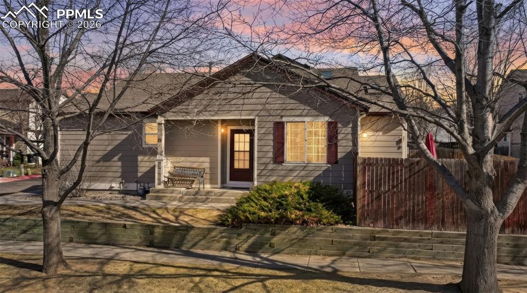 Experience the fresh, updated feel of brand-new carpet throughout this beautifully maintained, low-maintenance 2-bedroom, 2-bath ranch-style home—designed for effortless living from the moment you step inside. The inviting main level showcases a stunning two-sided gas fireplace, adding warmth and character while creating a cozy focal point between living spaces. Sunlight fills the main level area through large windows and skylights, and the well-appointed kitchen offers a convenient breakfast bar and abundant cabinet storage, making it perfect for both everyday living and entertaining. The spacious primary suite features a private adjoining bath, providing a comfortable and relaxing retreat. The finished basement adds valuable flexibility, offering a second living area that can easily function as a home office or potential third bedroom, along with a laundry space. Outside, enjoy a spacious backyard ready for relaxing evenings, pets, gardening, or entertaining friends and family. Additional highlights include a 2-car garage, crawlspace for extra storage, and an HOA that enhances ease of living with trash service and snow removal on walkways and roads. Conveniently located near parks, schools, military bases, and the vibrant Powers Corridor—home to shopping, dining, and entertainment—this home perfectly blends comfort, practicality, and location.