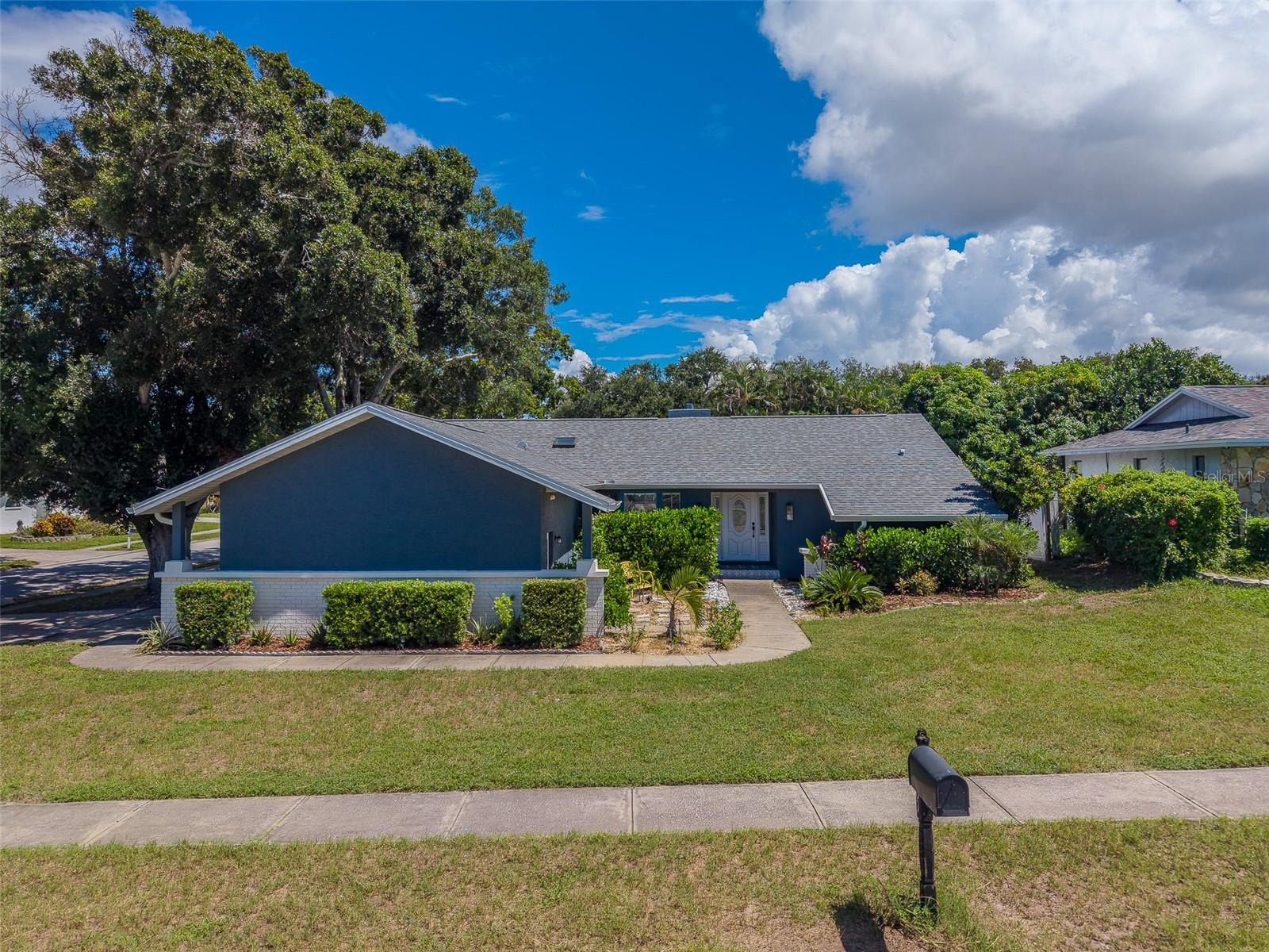 Welcome to 2709 Winding Way, Palm Harbor, FL 34683—a beautifully maintained 3-bedroom, 2-bath home offering over 1,700 square feet of comfortable Florida living in one of Palm Harbor’s most desirable locations. Situated on a spacious .25-acre corner lot with a large fenced backyard, this home combines an inviting floor plan, important recent improvements, and the location buyers are looking for.Step inside to a flowing split-bedroom floor plan designed for both everyday living and entertaining. The home has been moderately updated while maintaining a warm, welcoming feel and is move-in ready for its next owner. Generous living spaces provide plenty of room to gather with family and friends, while the split layout offers added privacy between the primary suite and secondary bedrooms.Major improvements include a 2021 roof and 2023 HVAC system, providing peace of mind for years to come. An oversized 2-car garage offers excellent space for vehicles, storage, bikes, beach gear, and more.Outside, the large fenced backyard provides room to entertain, play, garden, or simply enjoy the Florida sunshine. The quarter-acre corner lot adds a sense of space and privacy that's increasingly difficult to find.The location is outstanding. Enjoy living in the highly sought-after Palm Harbor area, convenient to local shopping, dining, recreation, and the beautiful Gulf Coast. Spend your weekends exploring nearby Honeymoon Island State Park, Dunedin, beaches, parks, and the Pinellas Trail, while still enjoying the feel of an established residential community. The home is also located within the highly regarded Palm Harbor school district.This is more than just a house—it's the kind of home and neighborhood where friends and family come together, celebrations happen, and memories are made.If you've been searching for a 3-bedroom home in Palm Harbor with a newer roof, newer HVAC, split floor plan, oversized garage, fenced backyard, quarter-acre corner lot, and convenient access to Honeymoon Island, 2709 Winding Way deserves to be at the top of your list.Well maintained, move-in ready, and perfectly positioned to enjoy the Palm Harbor lifestyle—welcome home.