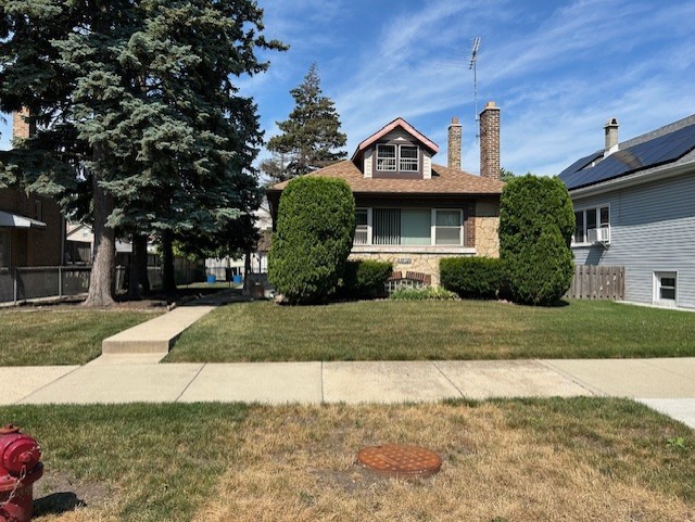 Charming Home on Oversized Lot -Endless Potential! The renovation starts here with you. Located in a great neighborhood. This well-loved home sits on an Oversized Chicago lot with a large backyard perfect for entertaining, gardening, or relaxing. The property features 3 bedrooms, 2 bathrooms, and a functional kitchen ready for your personal touch and updates. With a newer roof and a detached 2-car garage. The possibilities are endless in the walk-up unfinished attic. Full basement with full bathroom.    Hardwood flooring under carpeting.  Close to schools transportation, shopping, and interstate.  Whether you're seeking a comfortable space to move into or a rewarding renovation project, this home is a rare opportunity in a sought-after location. Property being sold As-Is.