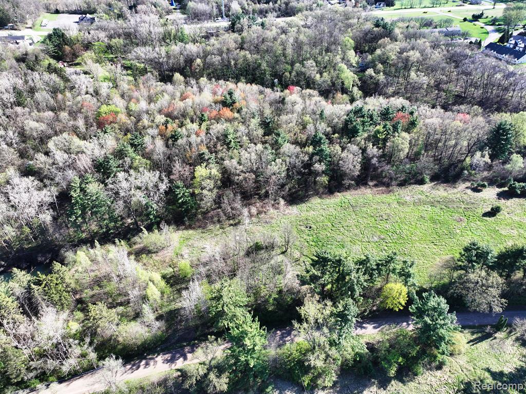 A developers dream! Just minutes from downtown Brighton, M23, & I96.  For the first time ever to hit the market, these 2 Parcels are being sold together #1234300038, #1234300025 totaling 17.48 acres zoned RM-1.  This is high density that allows 10 units per net acre.  Setbacks are 30ft from all lot lines.  Multiple buildings can be built with 20ft per building.  There is an existing house on the property of 5920 Pleasant Valley.  That property is currently occupied.  DO NOT ENTER THE PROPERTY WITH OUT PERMISSION.